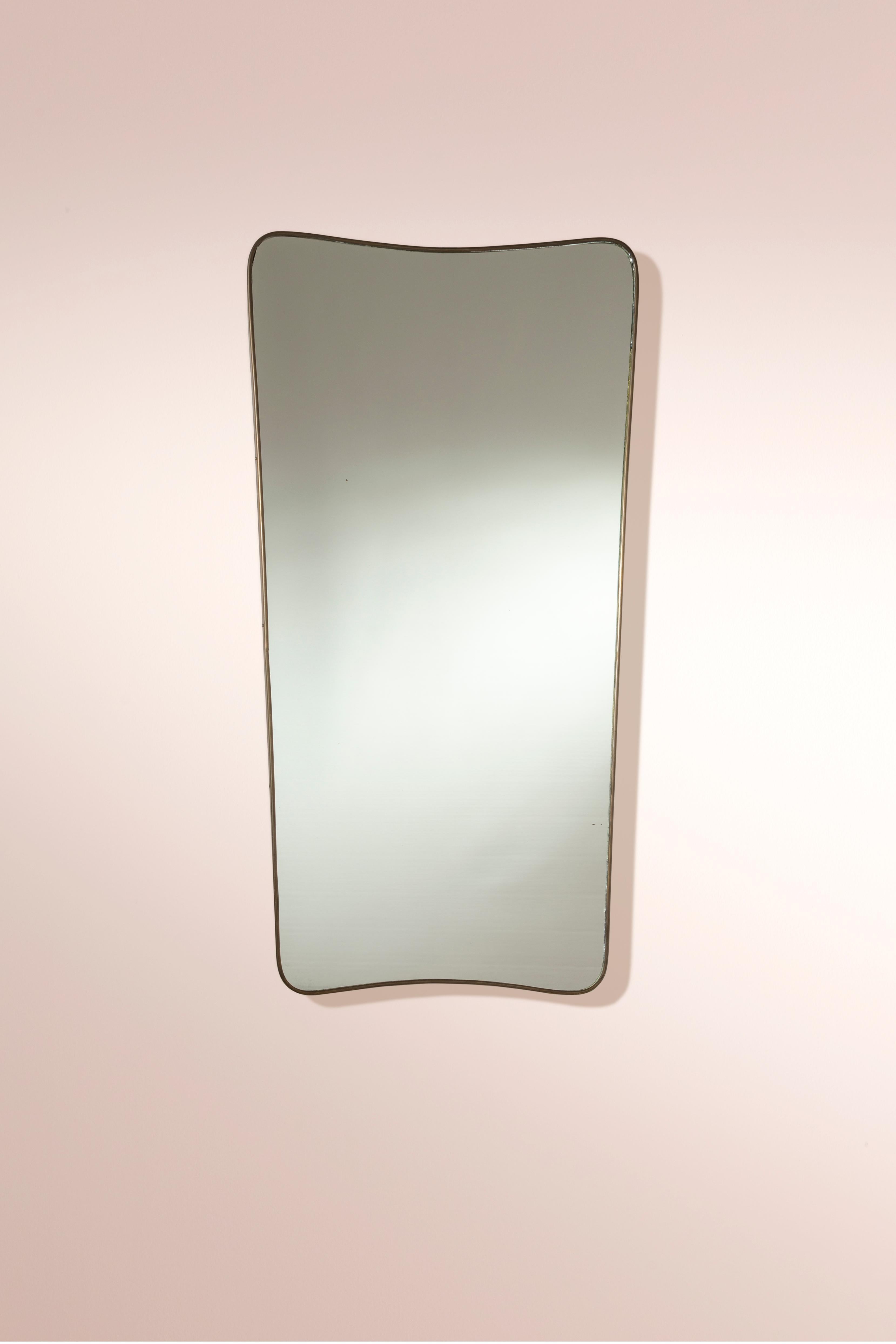An impressive Italian brass wall mirror, reminiscent of the style of Gio Ponti and originating from the 1950s, embodies an exquisite marriage of form and function with its understated yet sophisticated design.

Meticulously crafted, this Italian
