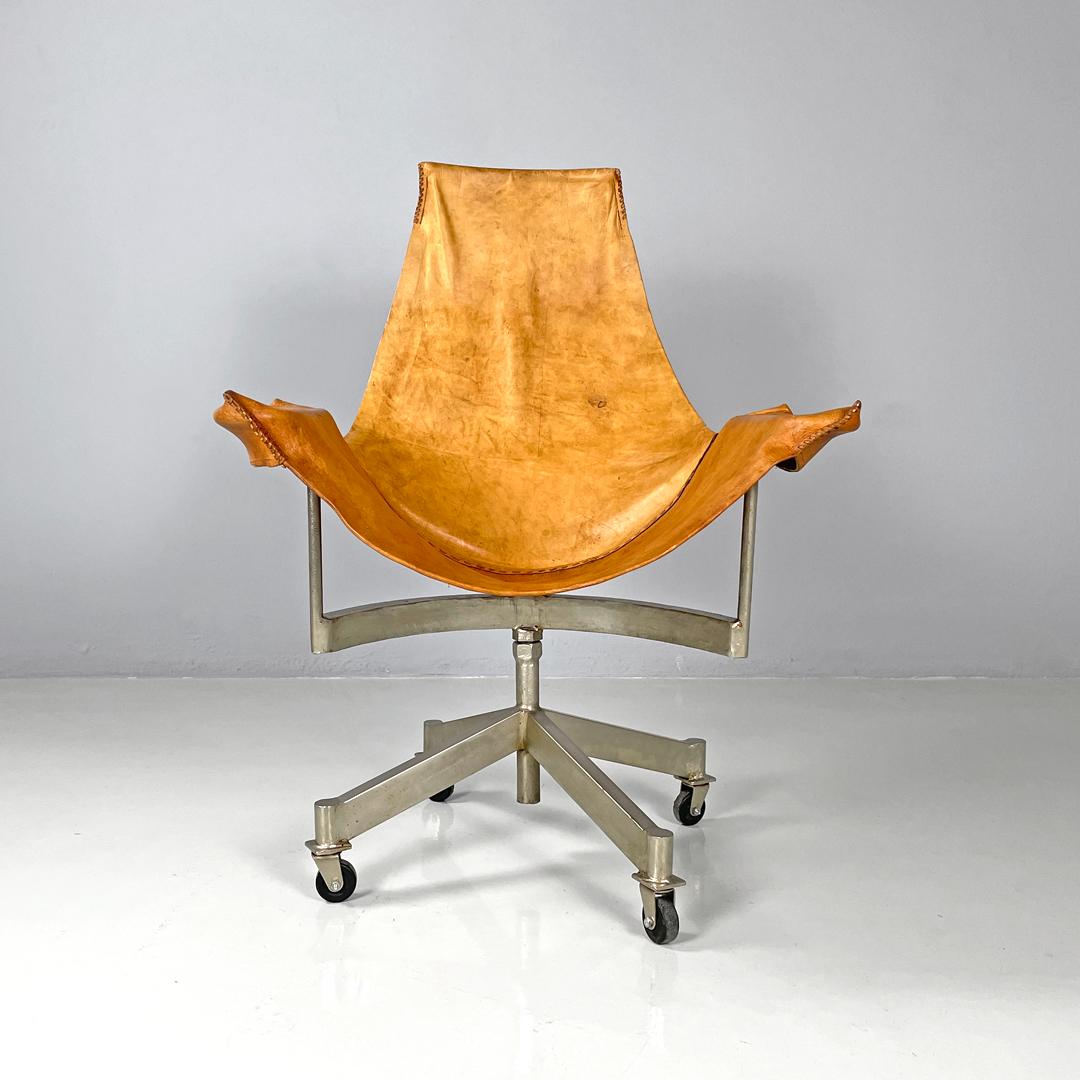 Italian mid-century modern brown leather swivel chairs with wheels, 1950s
Swivel chairs or office armchairs with wheels. The seat and backrest are made of a single part in brown leather that rests and fits onto the structure, the two armrests and