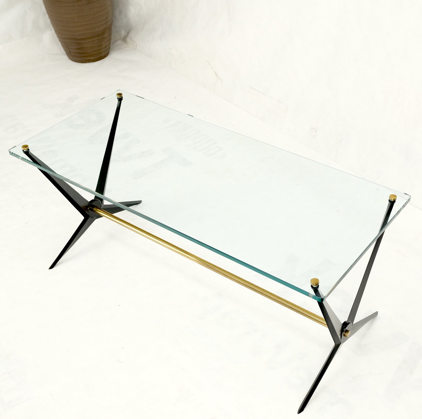 Italian Mid-Century Modern cast metal & brass base glass rectangle coffee table atr. to Gio Ponti.