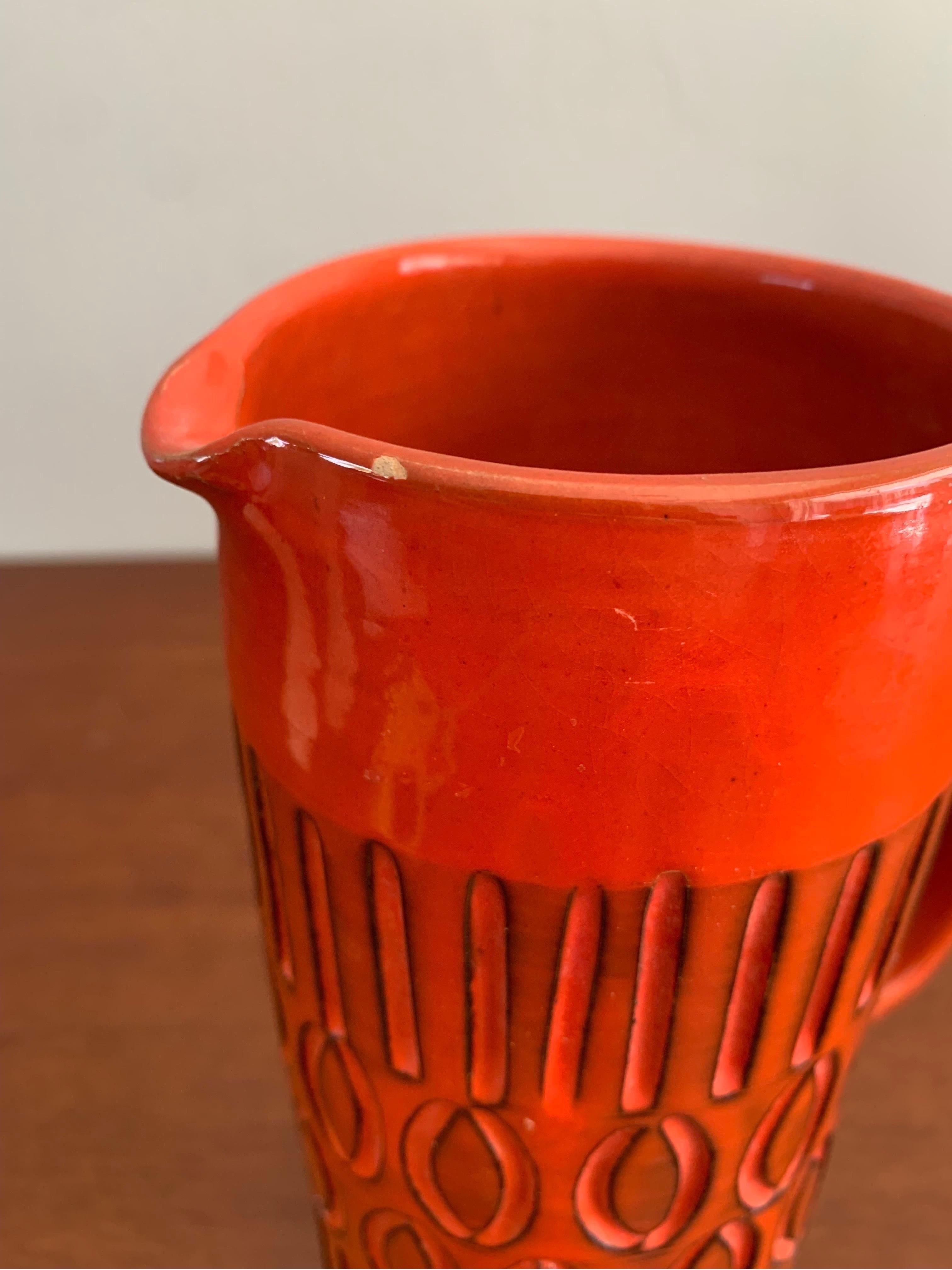 Mid-Century Modern Italian made vase. In the style and likely made by Bitossi or Alvino Bagni. 

Beautifully made with a deep dark orange red color. Would add a fun pop of color to any dining setting or used as a vase in any room. 

9.5” tall 6”