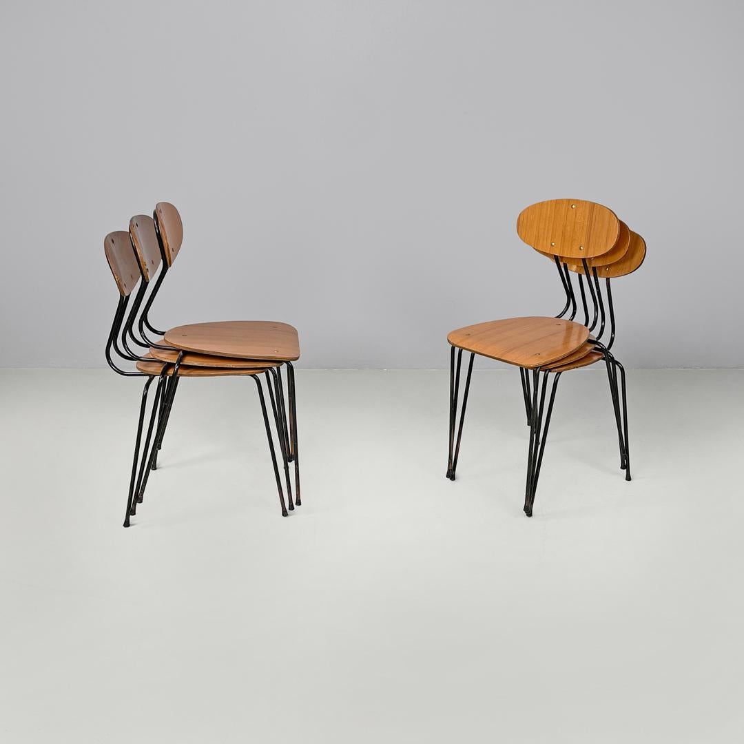 Italian mid-century modern chair in brown formica and black metal, 1960s
Set of six brown formica chairs with decorations that recall the texture of wood. The backrest is oval in shape, while the seat is triangular in shape with rounded corners. The
