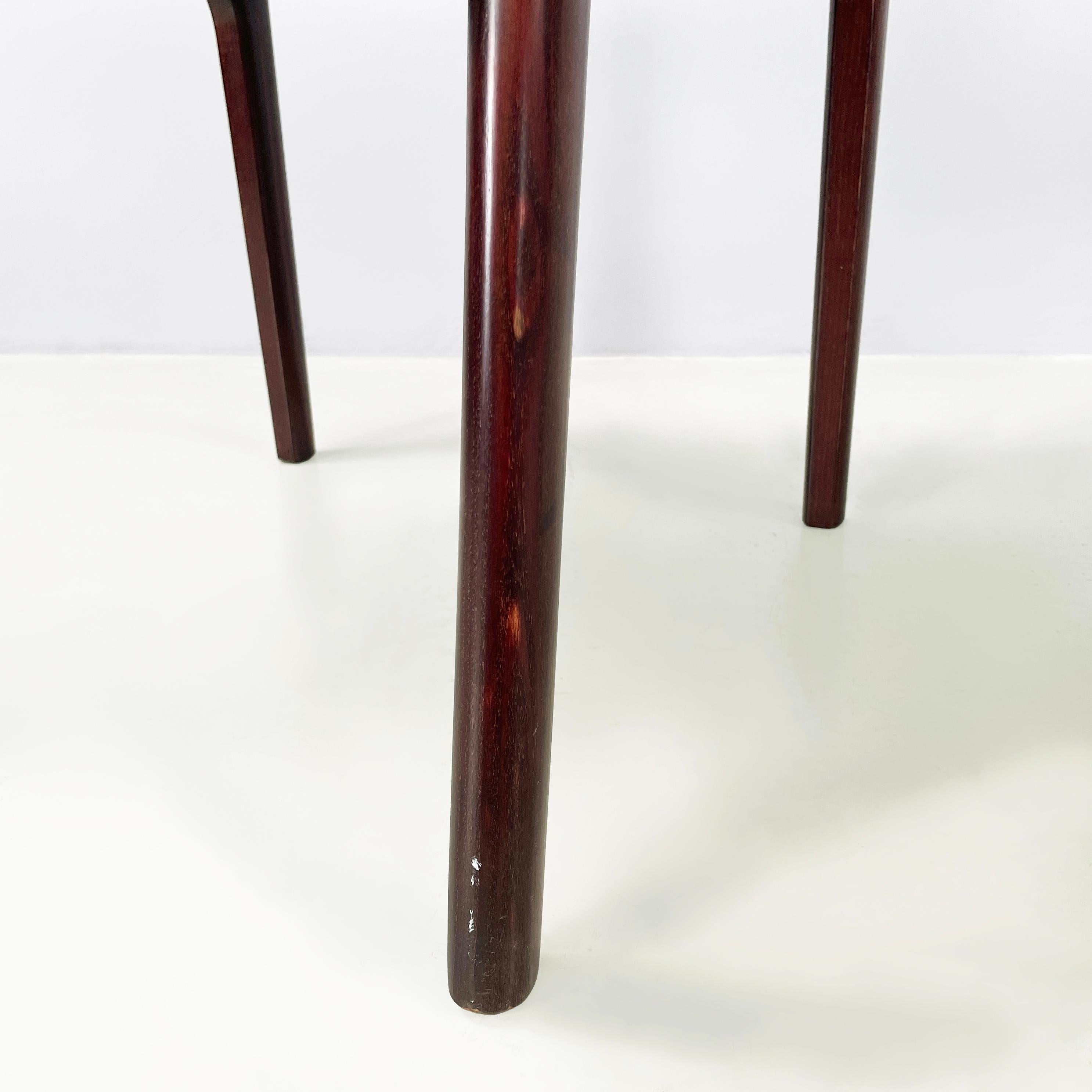 Italian mid-century modern Chair in brown leather and dark wood, 1960s
Pair of chairs with squared seats and backs, padded and covered in camel brown leather. The dark wood structure has a rounded shape and is curved in the backrest part.
They came
