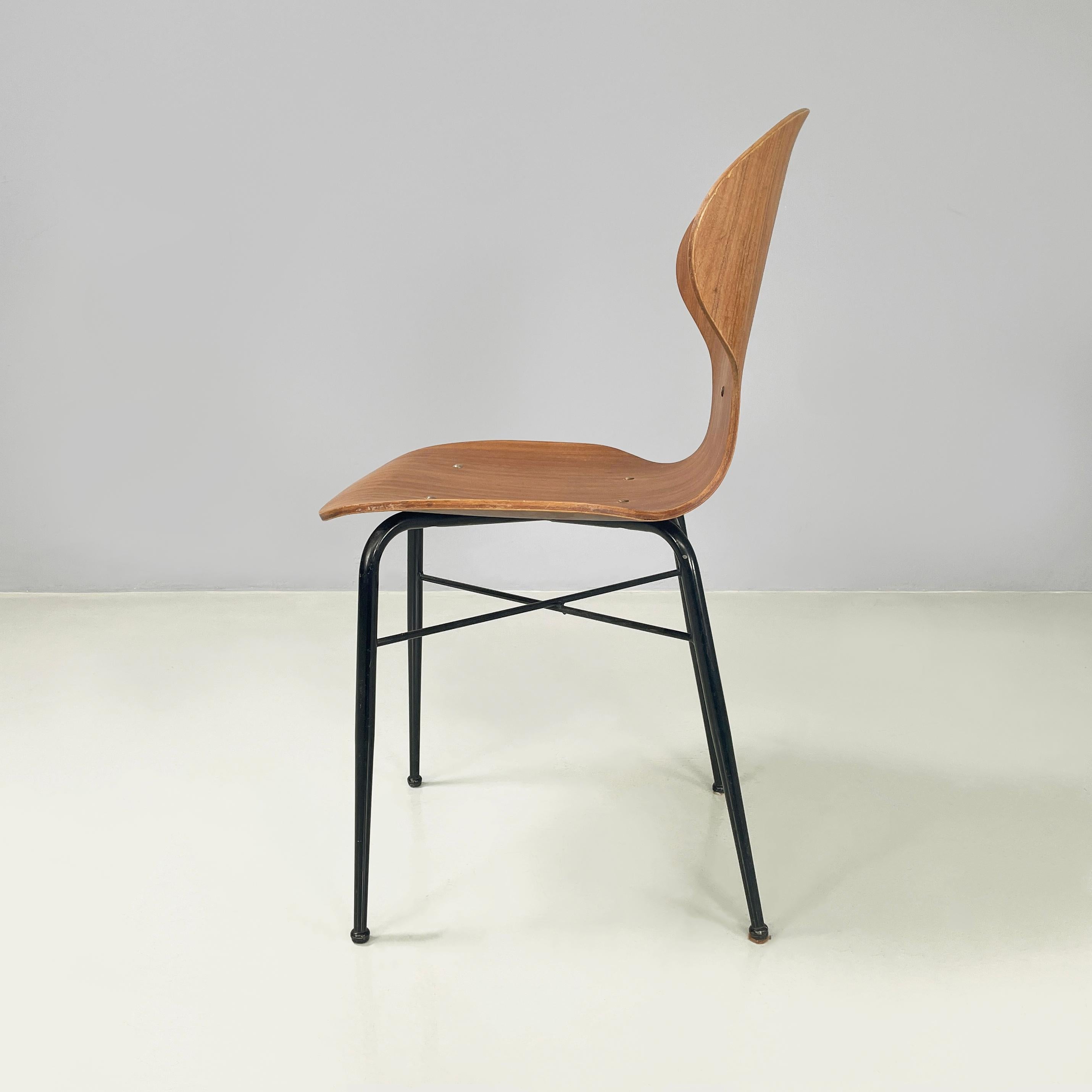 Italian mid-century modern Chair in curved wood and black metal, 1960s
Chair with shaped seat and back in curved wood. On the backrest it has a decorative oval hole and round metal studs. Under the seat there is an X-shaped structure in black metal