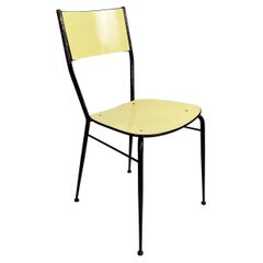Sedia italiana di metà secolo moderno in laminato giallo chiaro e metallo nero, anni '60