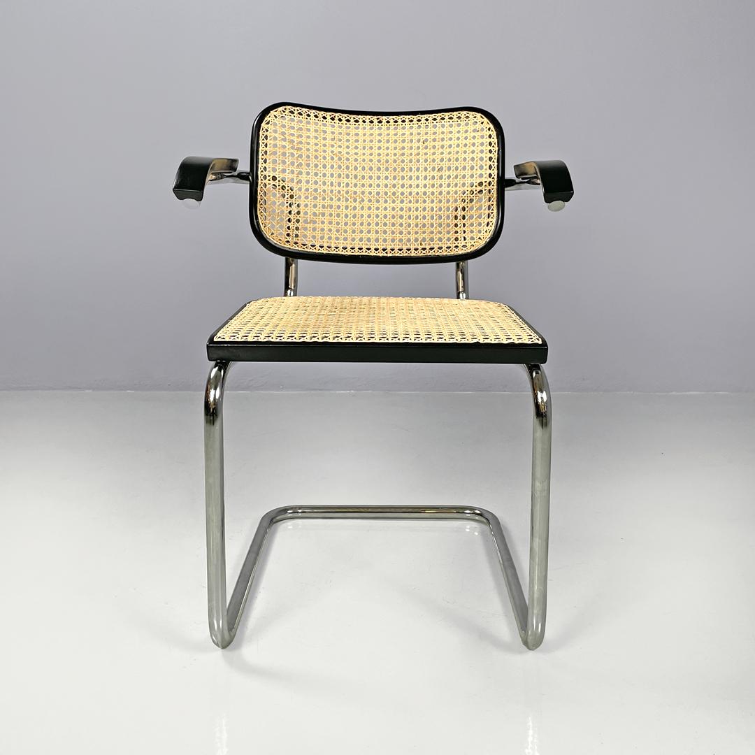Italian mid-century modern chair with armrests Cesca by Breuer for Gavina, 1960s
Set of 6 chairs mod. Cesca with armrests. The seat and backrest are in Vienna straw with black painted wooden profiles. The structure is in tubular steel. The armrests