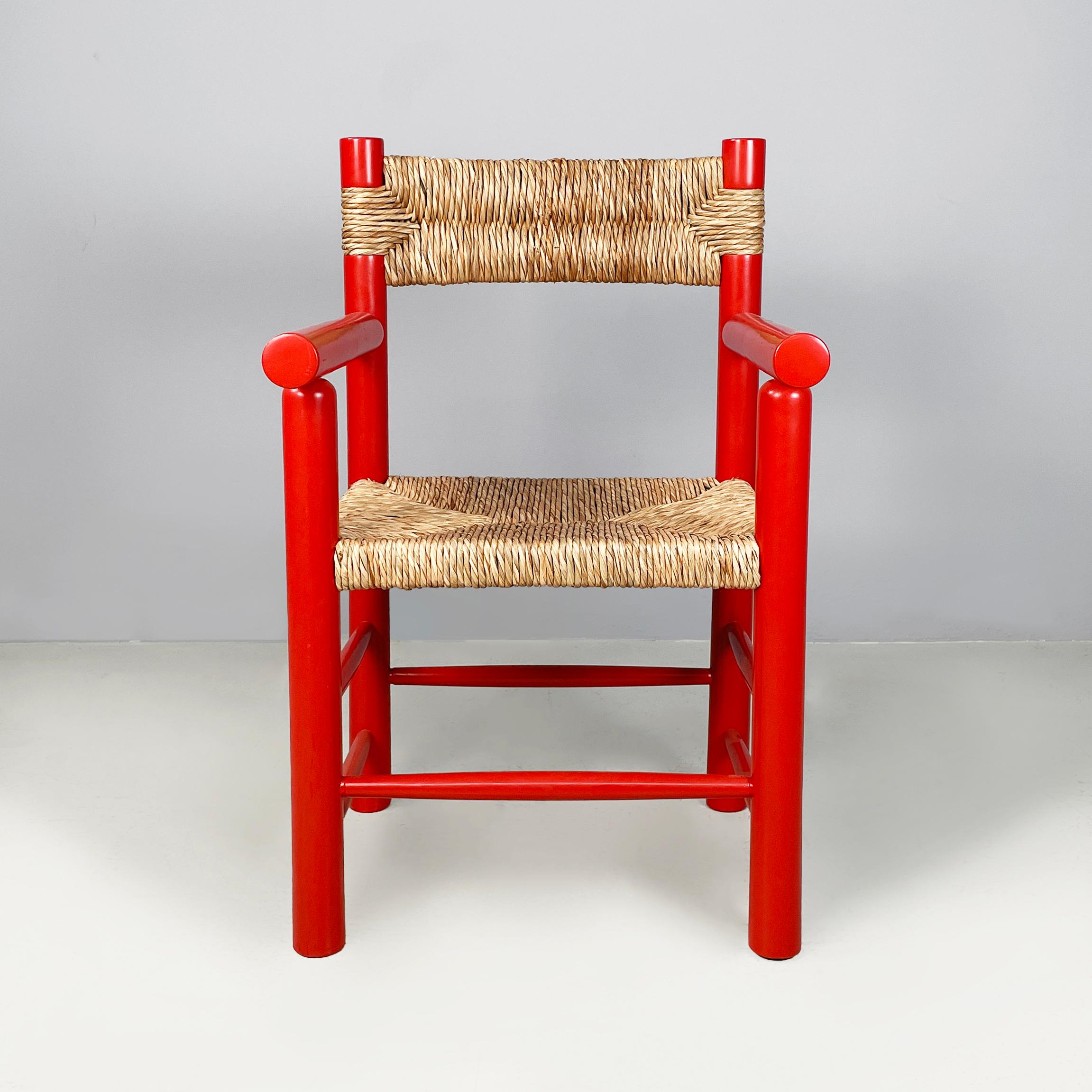 Italian mid-century modern chairs with armrests in red wood and straw, 1970s
Pair of chairs with armrests with square seat and backrest in woven straw. The structure, armrests and legs with round section are in red painted wood.
1970s.
Good