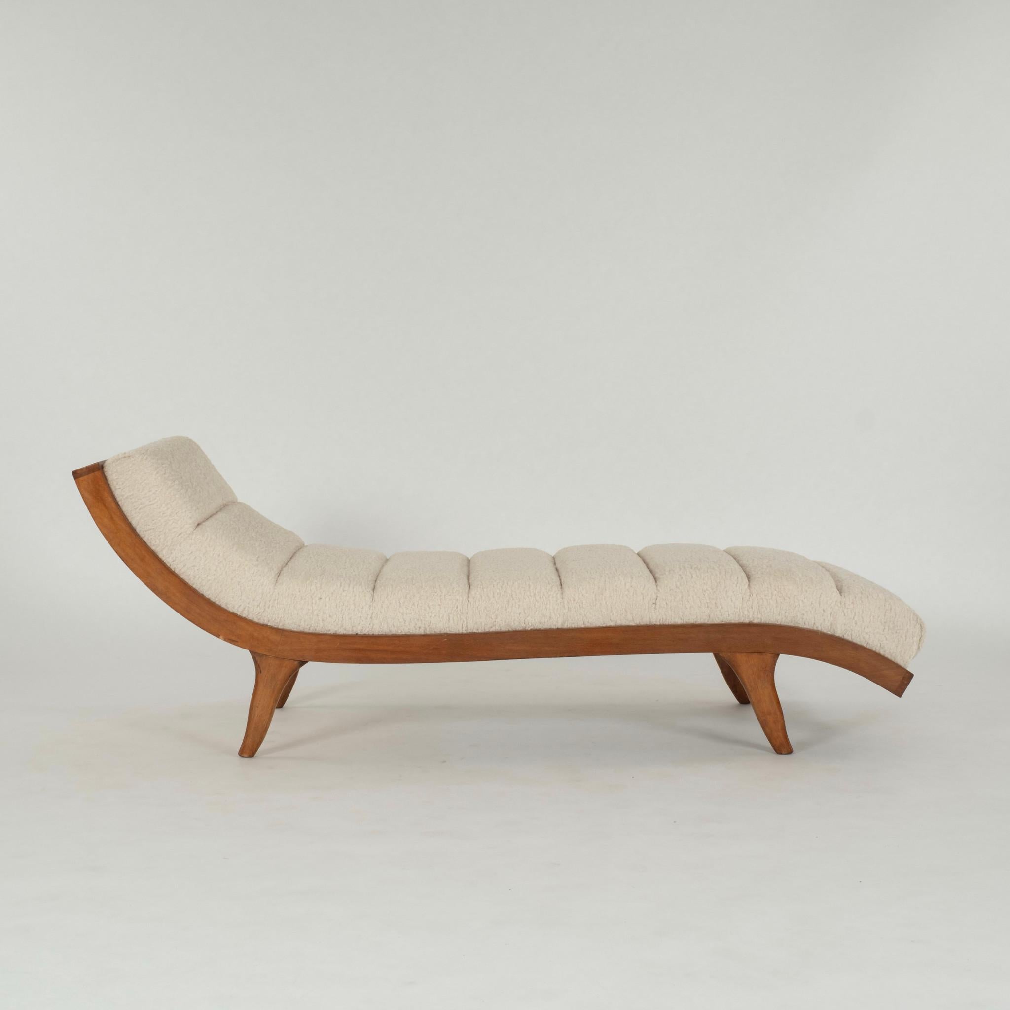 A stylish Italian Mid Century Modern undulating wood chaise with ecru boucle upholstery.
