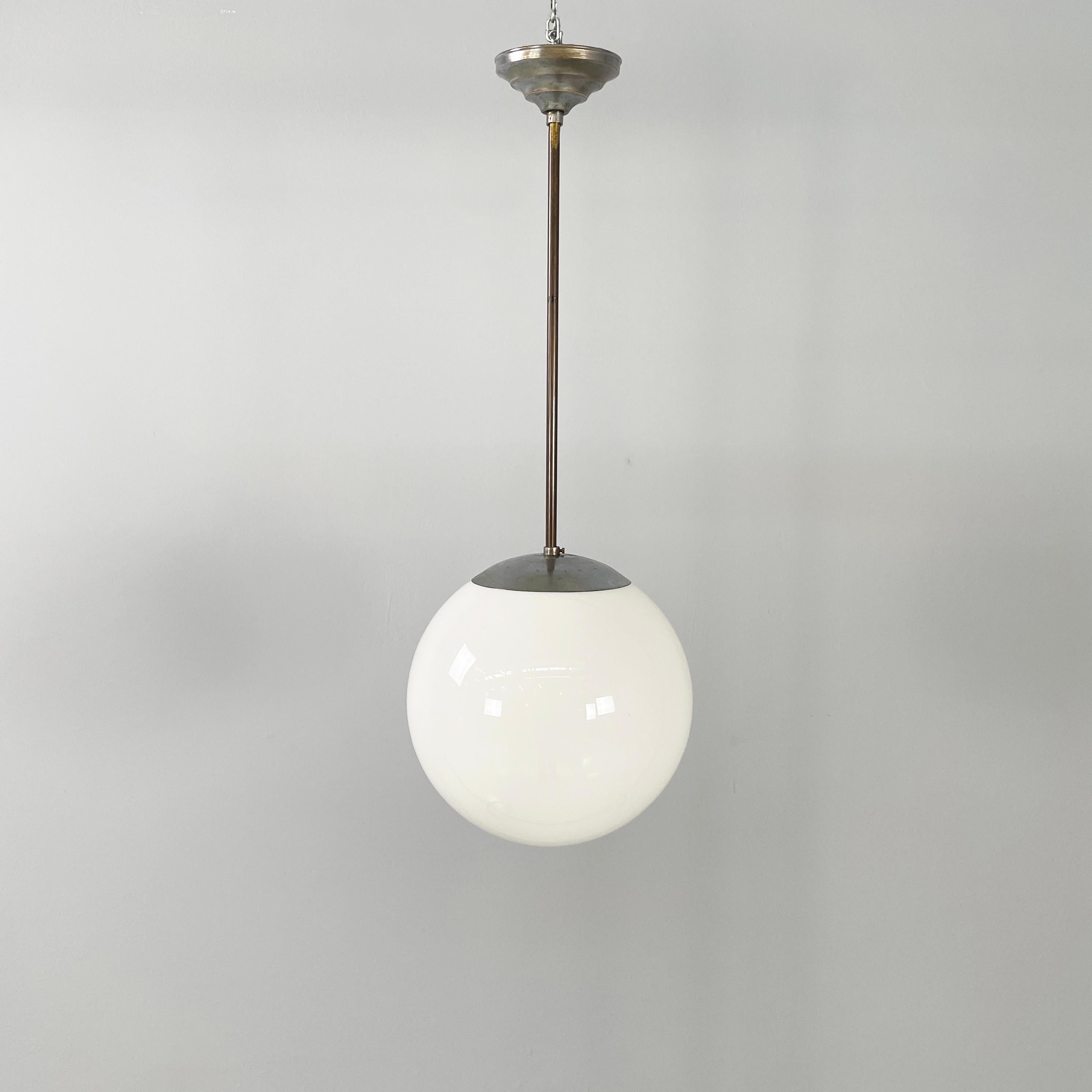 Italian mid-century modern/art deco Chandelier in opaline glass and metal, 1940s
Chandelier with spherical opaline glass diffuser. The structure is made up of a curved and round part, that is the connection to the diffuser, and a metal rod. The