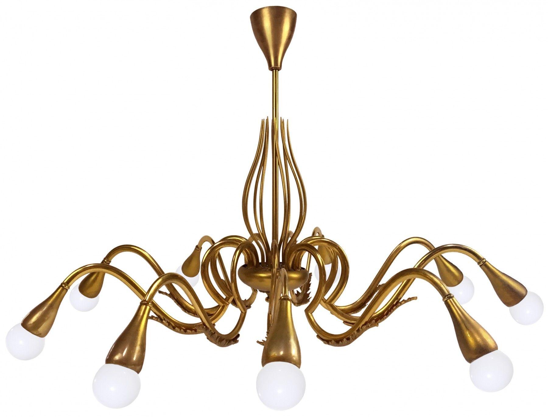 Italian Mid-Century Modern Nine Arm Organic Form Solid Brass Chandelier, 1960s
 
A large brass chandelier with twelve arms with filigree detail, Italian, Circa 1960's Oscar Torlasco was born in Rome, Italy, in 1934. Torlasco designed many beautiful