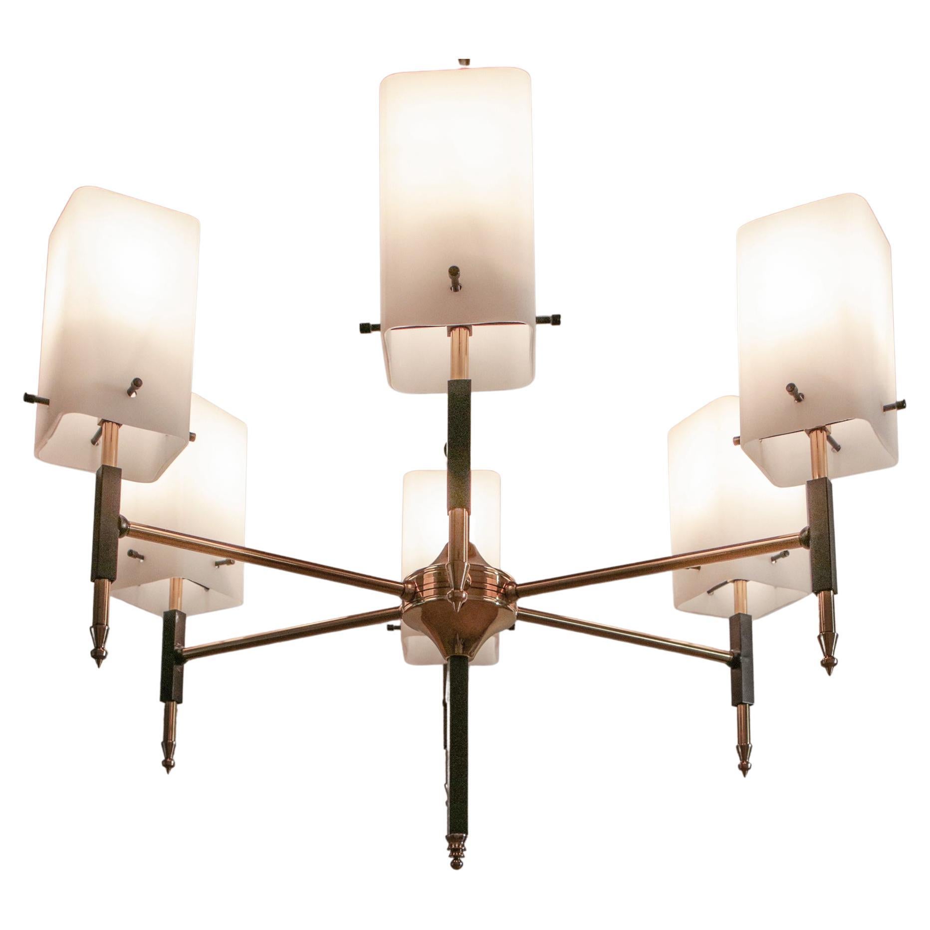 Splendid Italian Mid-Century Modern chandelier from the 1950s. It is made of polished brass, black painted aluminum, and opal coated glass with six lights in E14 format. Elegant and refined line. The restoration was made with great care by a