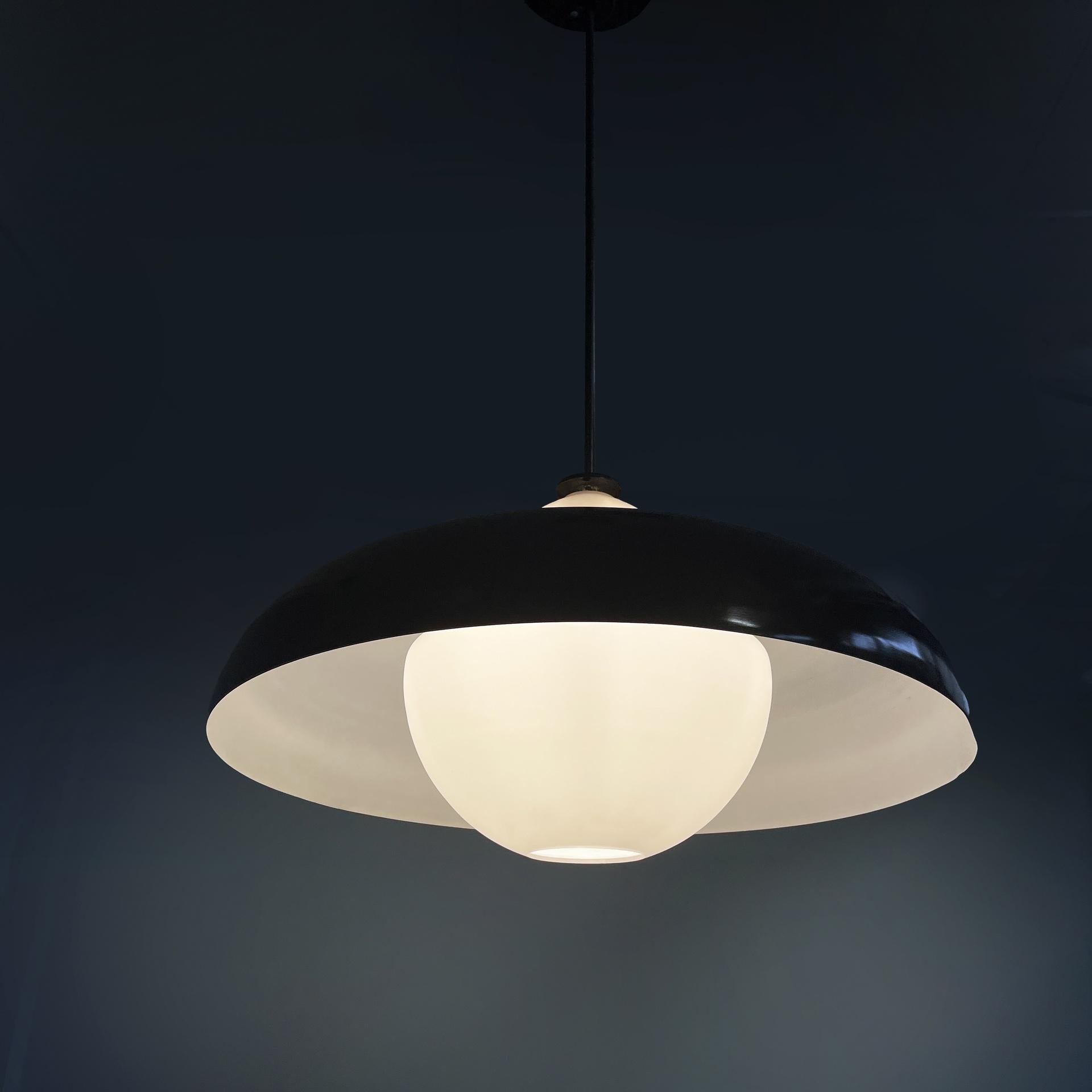 Italian mid-century modern chandeliers LS8 by Luigi Caccia Dominioni for Azucena, 1960s
Pair of chandeliers or ceiling lamps model LS8 with rounded diffuser in opaline glass, which has a curved lampshade in metal painted white on the inside and