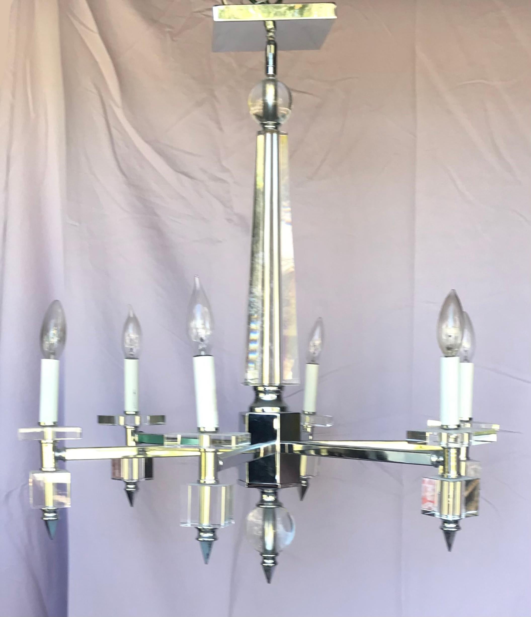Italian Mid-Century Modern chrome and Lucite six-light chandelier

This elegant and glamorous chandelier is created in the tasteful tradition of Italian design. An abundance of polished chrome and Lucite give this chandelier it’s luxurious