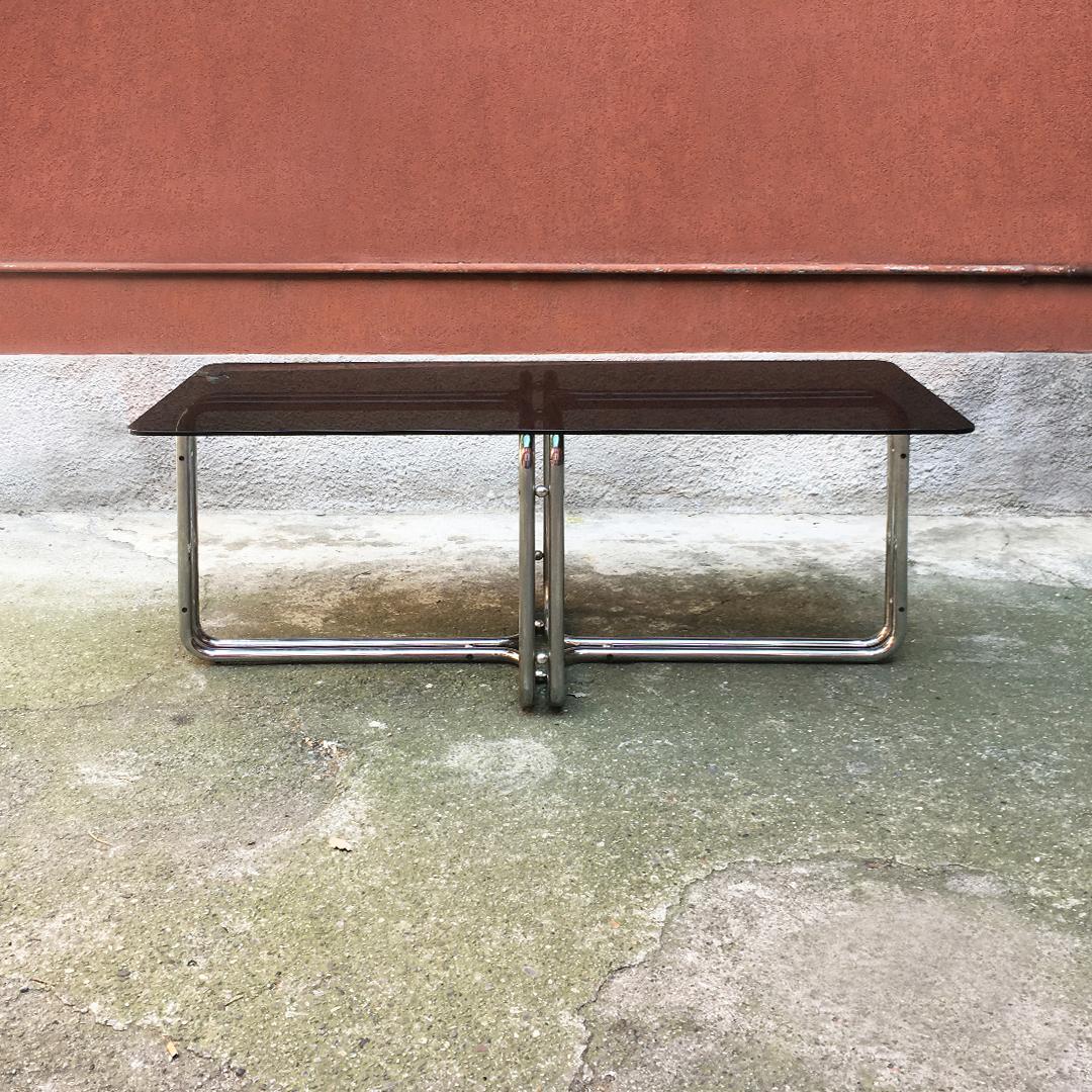 Italian Mid-Century Modern chromed dining table with smoked top, 1970s
Dining table with chromed tubular steel leg and smoked glass top with rounded corners.

Excellent condition, some oxidation points present.

Measures: 180 x 78 x 75 H cm.