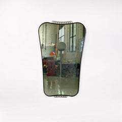 Italian mid century modern coat-of-arms-shaped burnished brass wall mirror, 1950