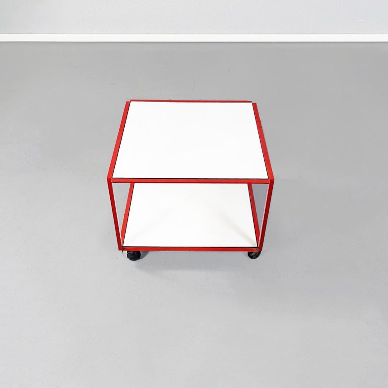 Italian Mid-Century Modern ??coffee table by Alias, 1980s.
Coffee table with two tops in white painted wood and metal structure painted in red. Can be used as cart.

Produced by Alias ??Italia, with label present on the red one.

1980s.

Good