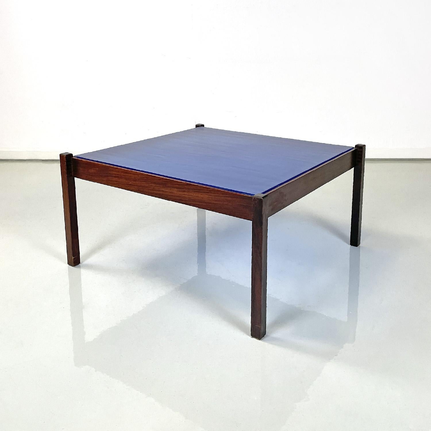 Italian mid-century modern coffee table by Gianfranco Frattini for Bernini 1960s
Rectangular coffee table. The top is made of an intense blue glass sheet with a raised striped texture. The structure is made of wood, has four legs with a square
