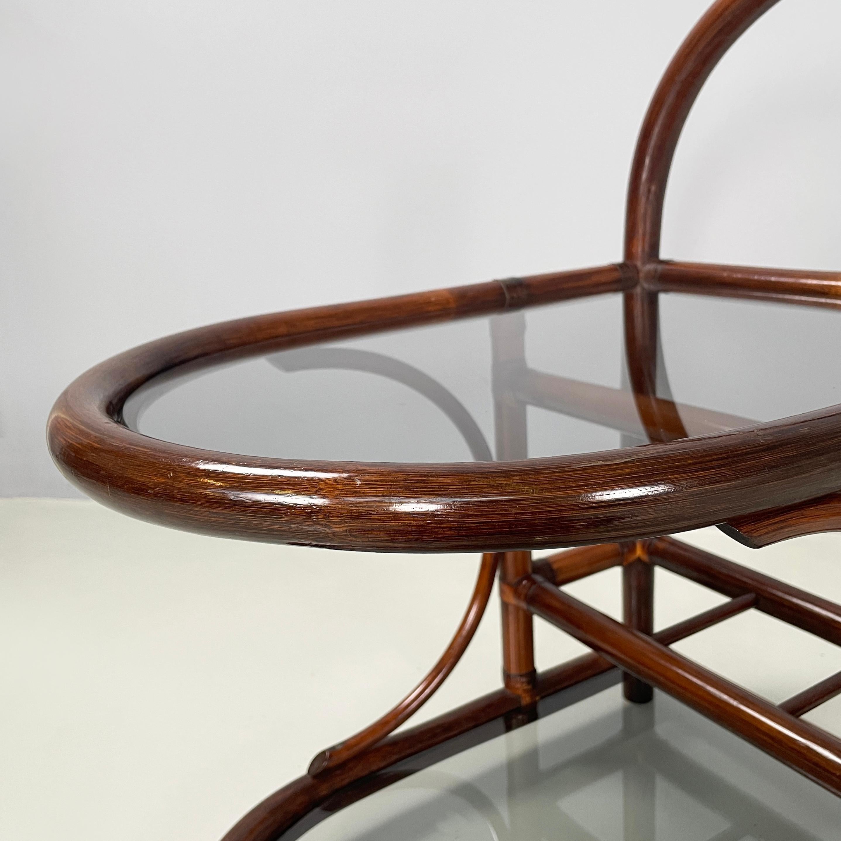 Mid-20th Century Italian mid-century modern coffee table in smoked glass and dark bamboo, 1960s For Sale