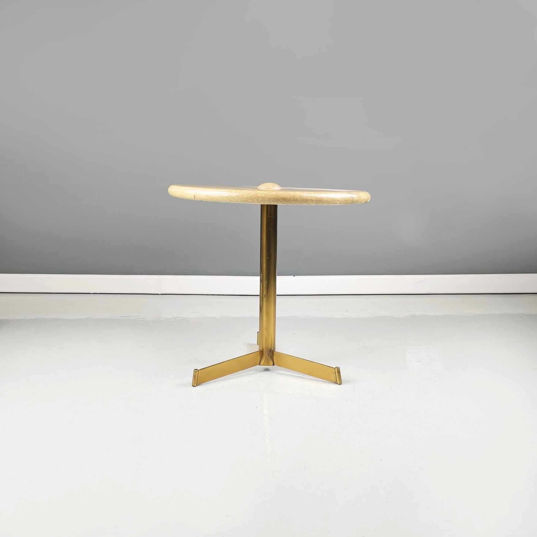 Italian Mid-Century Modern Coffee table in wood, parchment and brass by Aldo Tura, 1960s
Coffee table with round wooden top covered in beige-brown parchment. At the center of the round top there is a hemisphere. The central leg is in tubular with 3