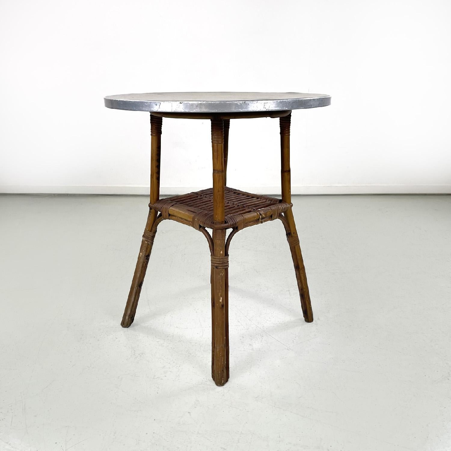 Italian mid-century modern coffee tables in bamboo and aluminum, 1960s
Set of three round coffee tables. The round top is made of aluminium, the structure is made of finely woven bamboo and comprises a top in the central part and the four legs.