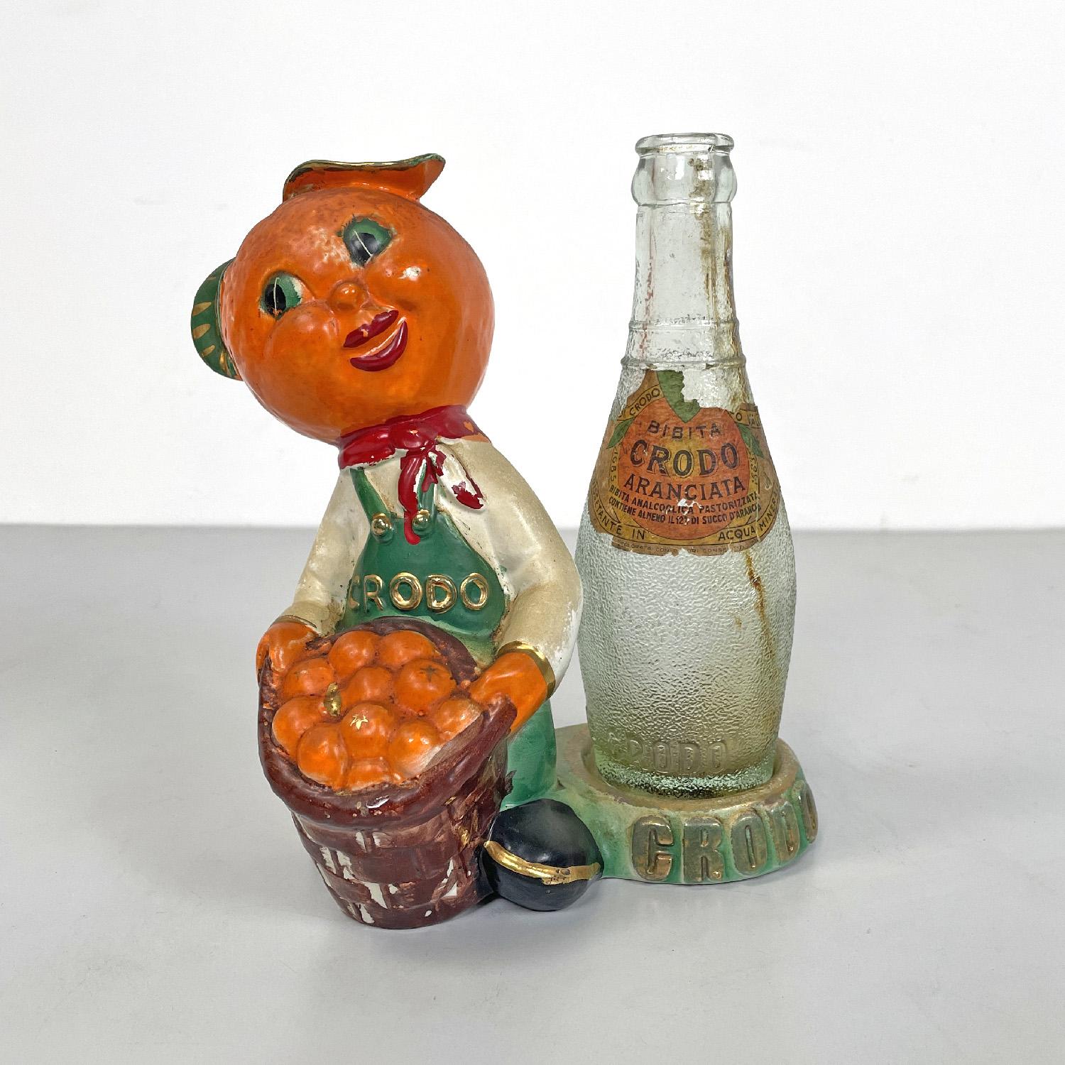 Italienische Werbeskulptur von Crodo aus der Mitte des Jahrhunderts mit Glasflasche, 1960er Jahre
Werbeskulptur aus glasierter Keramik. Die Figur ist das Maskottchen der Marke, hat eine Mandarine als Kopf und trägt einen Korb voller Mandarinen, die