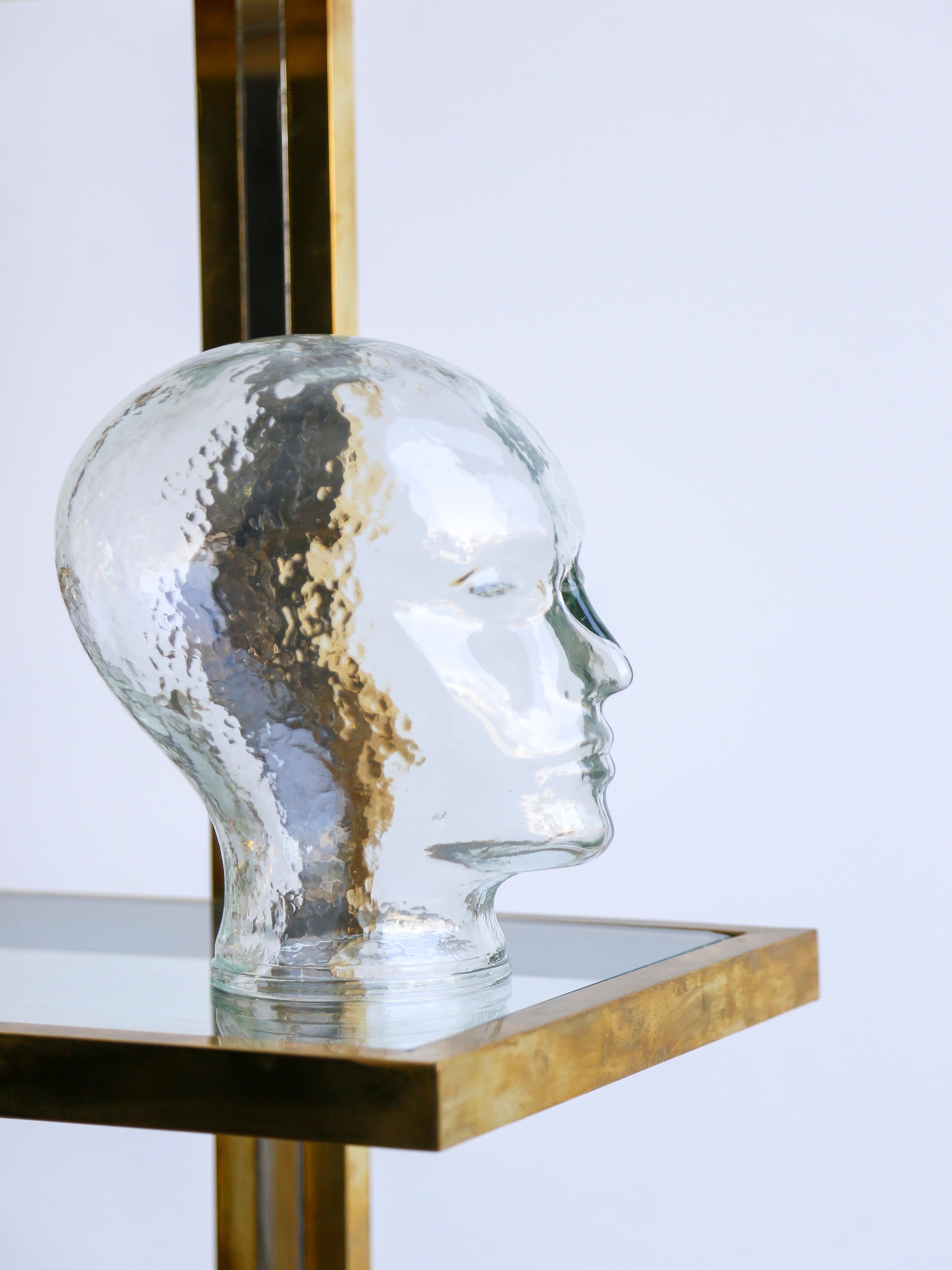 Mid Century Modern crystal glass head table sculpture by the famous Piero Fornasetti. 

Piero Fornasetti (1913–1988) was an Italian designer and artist known for his creative and whimsical designs across various disciplines, including furniture,