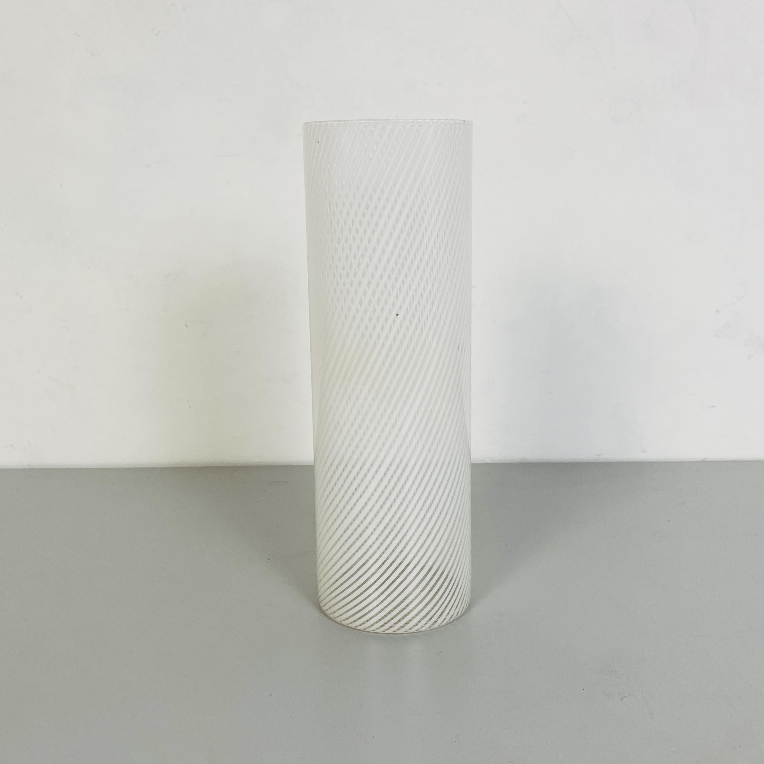 White Murano glass vase, 1970s with cylindrical white spiral pattern.
Murano artistic vase for flower or just to decorate a library or a center of a table.
The pattern look like Reticella effect but it is not, this is after, near the 1970s period,