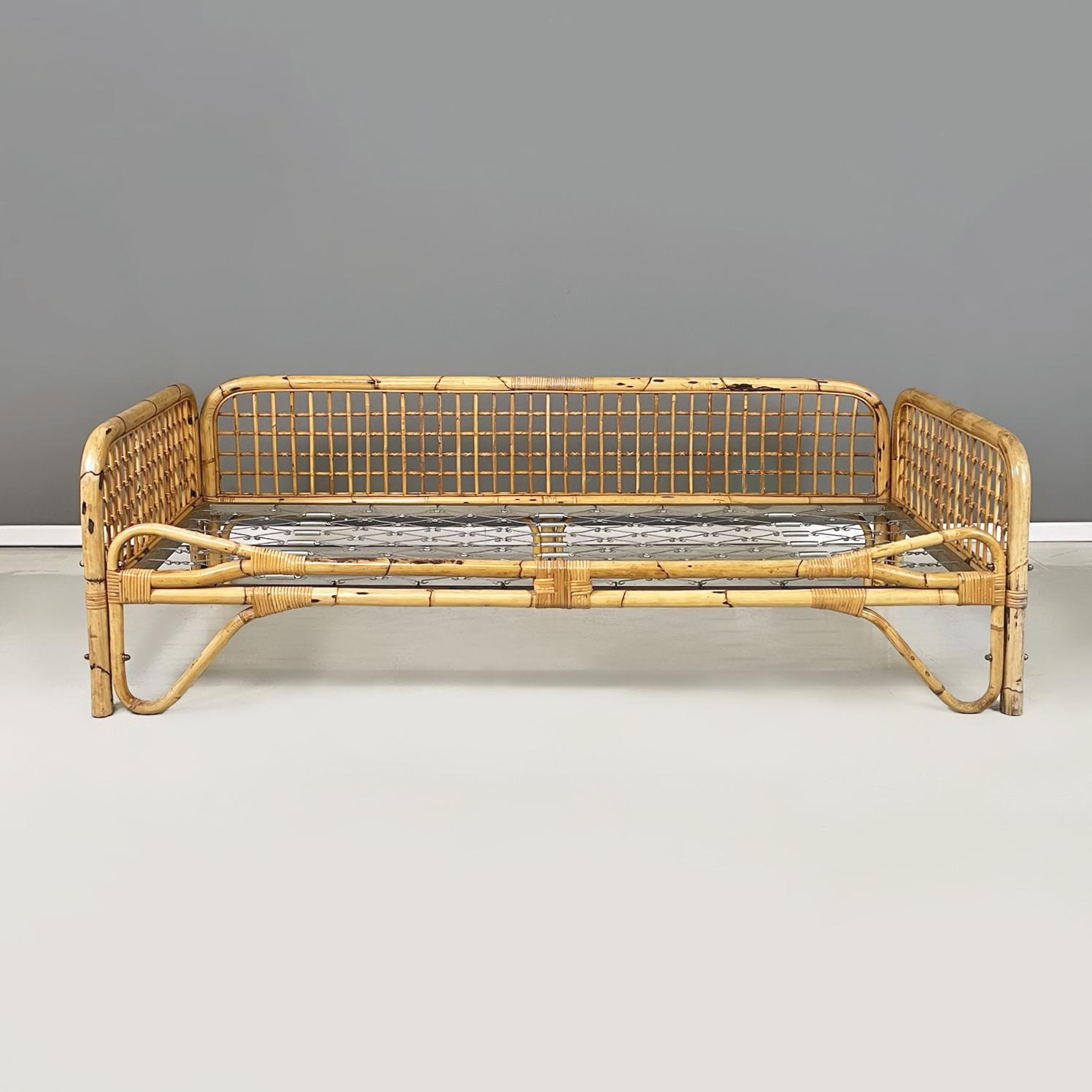 Italian mid-century modern daybed, bed or sofa in rattan and metal mesh, 1970s
Daybed with finely woven rattan structure. The seat is made of a metal mesh, perfect for placing a mattress and making it a bed or an outdoor sofa. Square armrests with