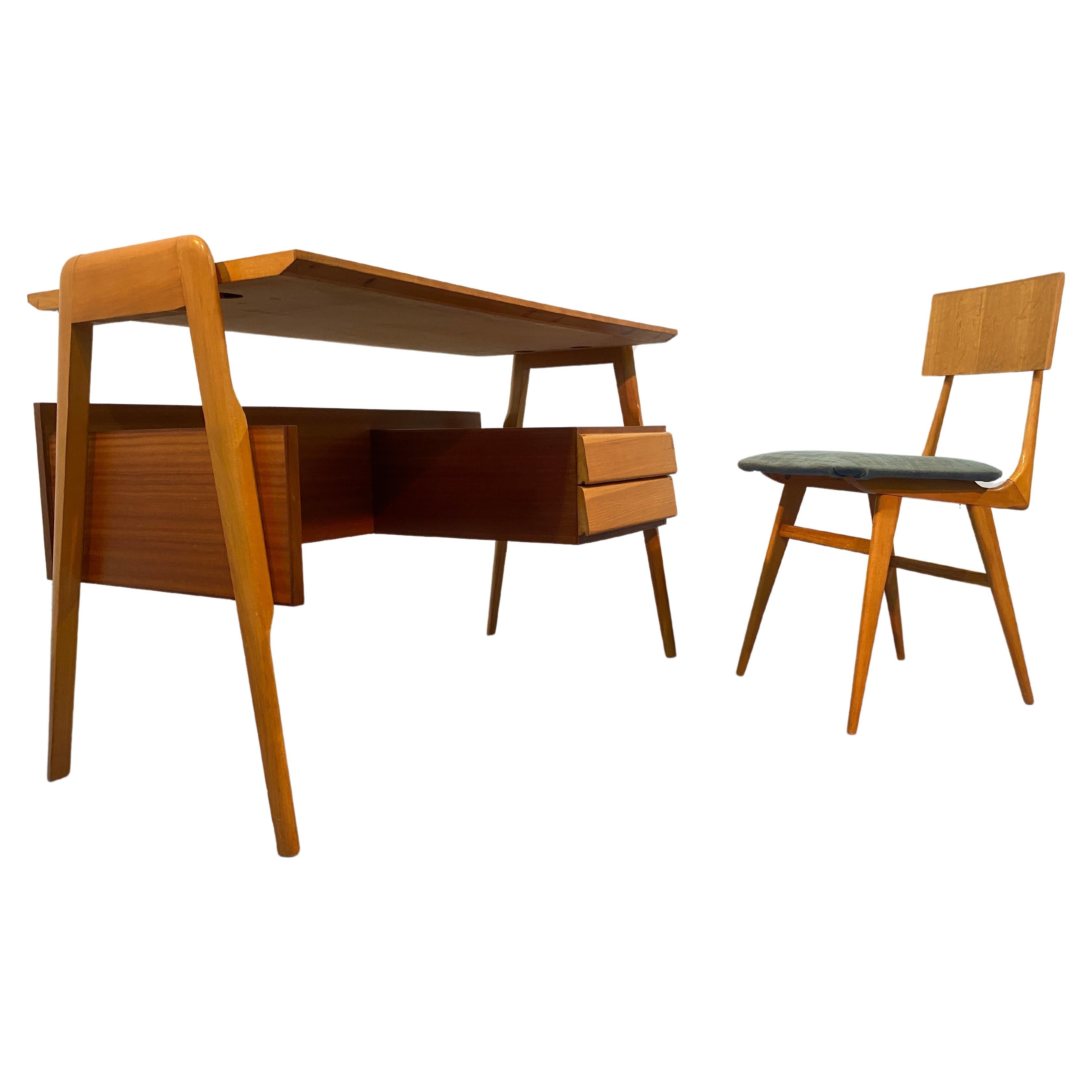 Italian Mid-Century Desk and Chair Designed by Vittorio Dassi in the 1950s

This stunning Italian Mid-Century desk and chair set was designed by the renowned designer Vittorio Dassi in the 1950s. The combination of various types of wood used in the