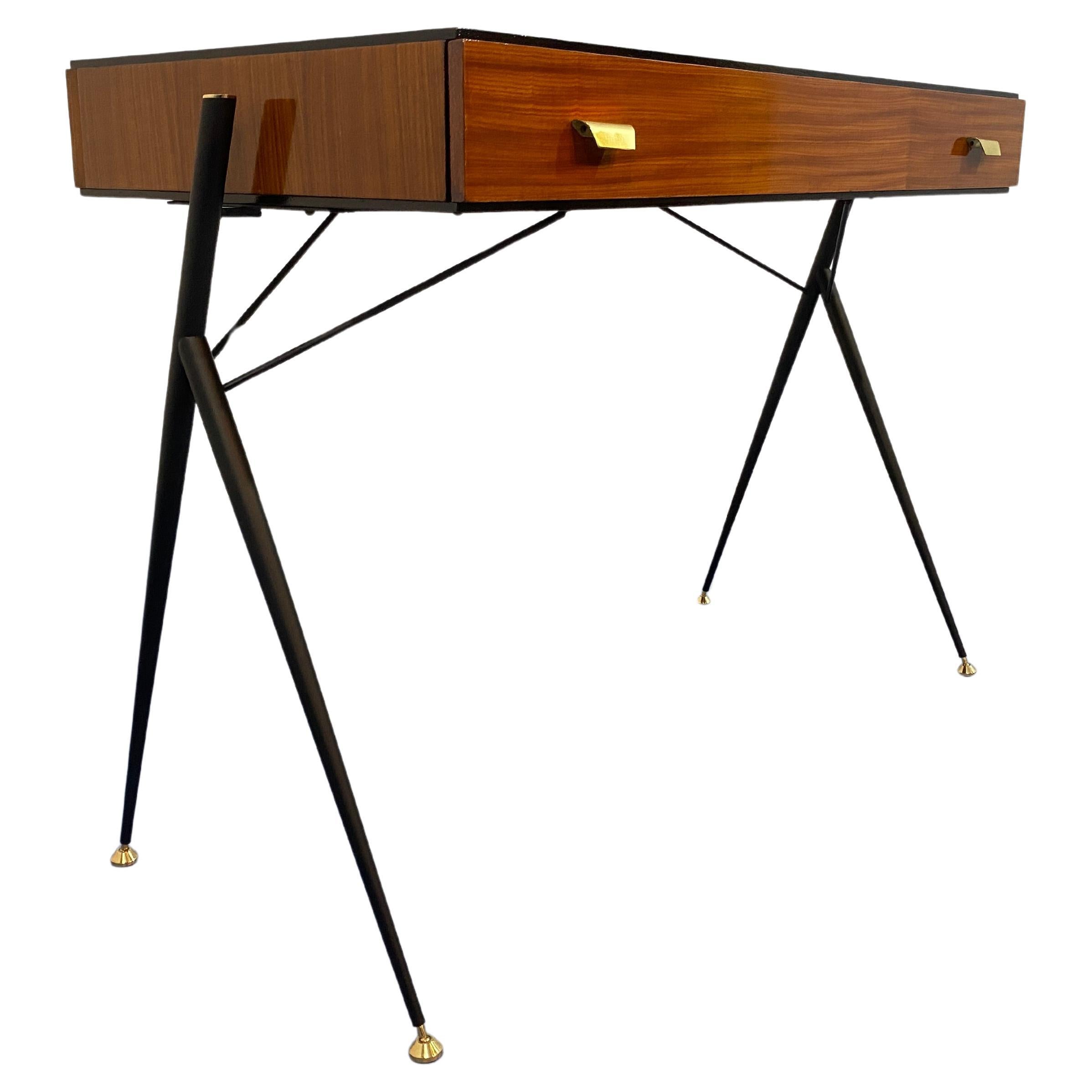 Italian Mid-Century Desk by Silvio Cavatorta, 1950s
This striking desk was designed by the renowned Italian designer Silvio Cavatorta in the 1950s. The desk features a unique and refined metal frame with a distinctive design. The upper part is