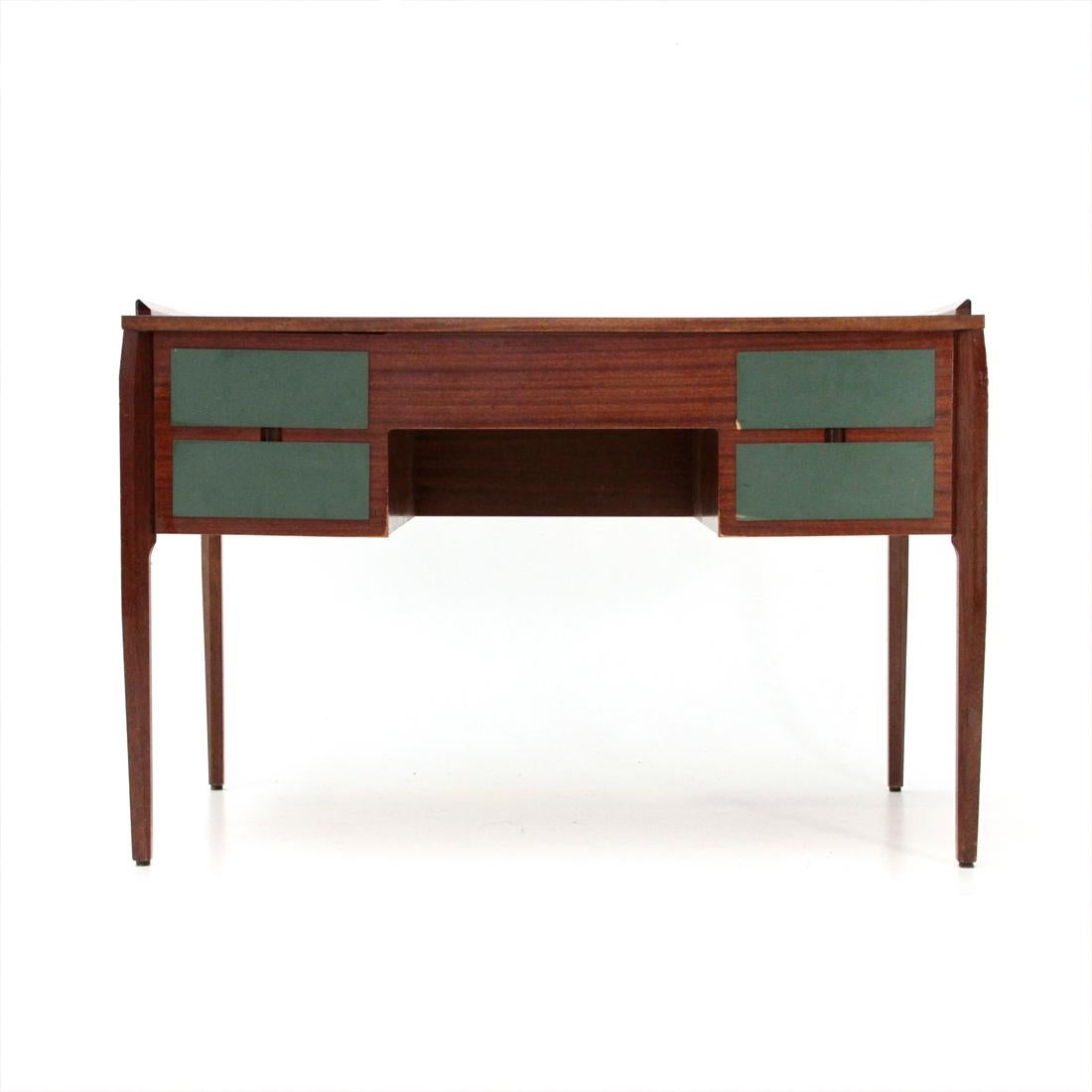 Italian manufacturing desk produced in the 1960s.
Teak veneered wood structure.
Top and front of the drawers veneered in green ant.
Teak legs cut in jade.
Good general conditions, some signs and lack of ant on the drawers due to normal use over