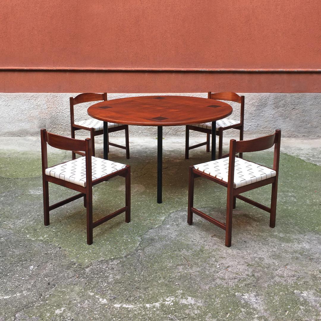 Italian Mid-Century Modern dining table by Ettore Sottsass for Poltronova, 1956
Dining table with solid wood top with four black squares in correspondence of each leg, characterized by the round section and the adjustable tip.
This is one of the