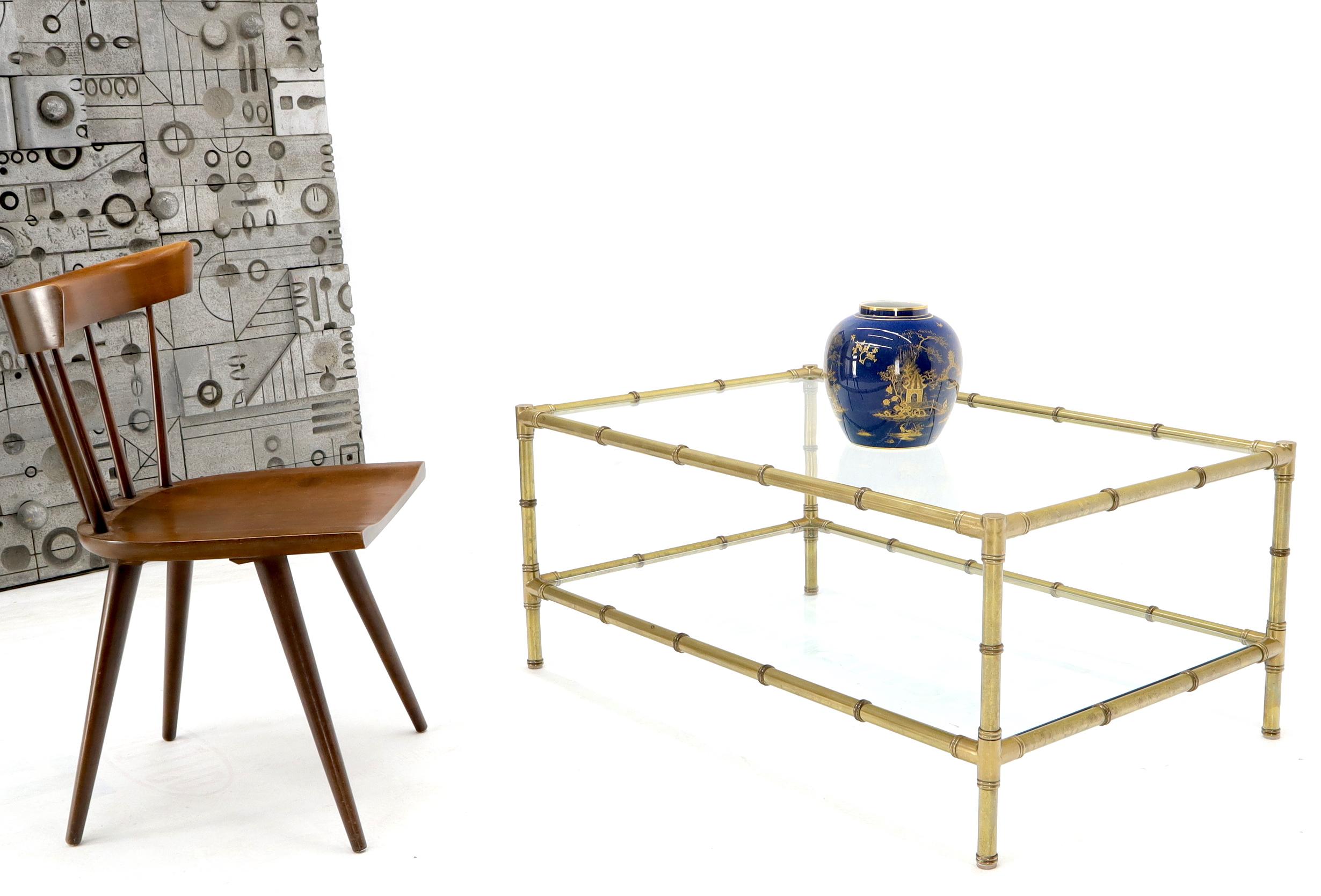 Two-tier glass top rectangle coffee table. High quality machined thick brass tubing.