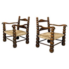 Italian mid-century modern finely crafted armchairs in wood and straw, 1960s