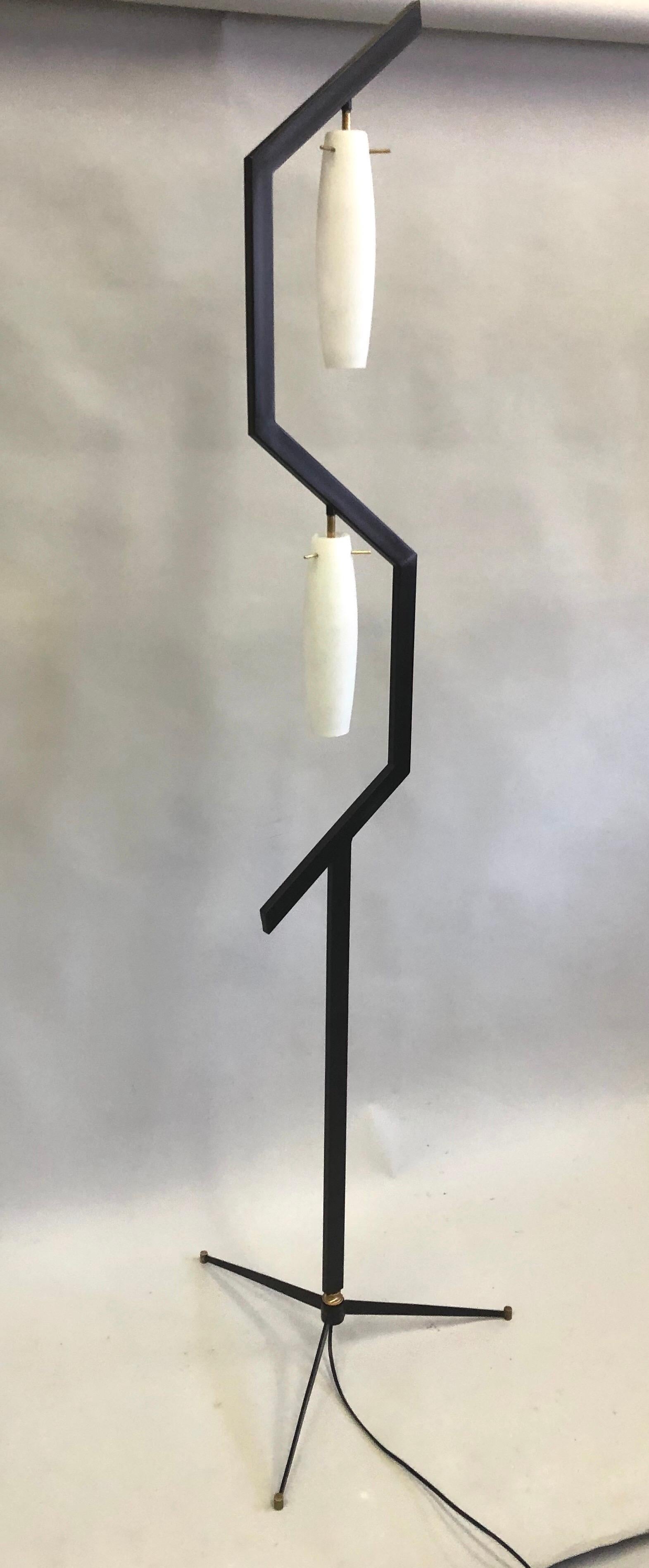 Rare and exceptional Italian Mid-Century Modern floor lamp in the style of Angelo Lelli for Arredoluce. The entire composition is ultra-modern / futurist in its conception; it's daring zig-zag form projects a sense of dynamic movement and forward