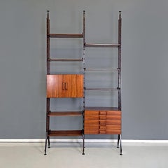 Italian mid-century modern floor-to-ceiling wood and brass bookcase, 1960s