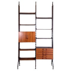 Italian mid-century modern floor-to-ceiling wood and brass bookcase, 1960s