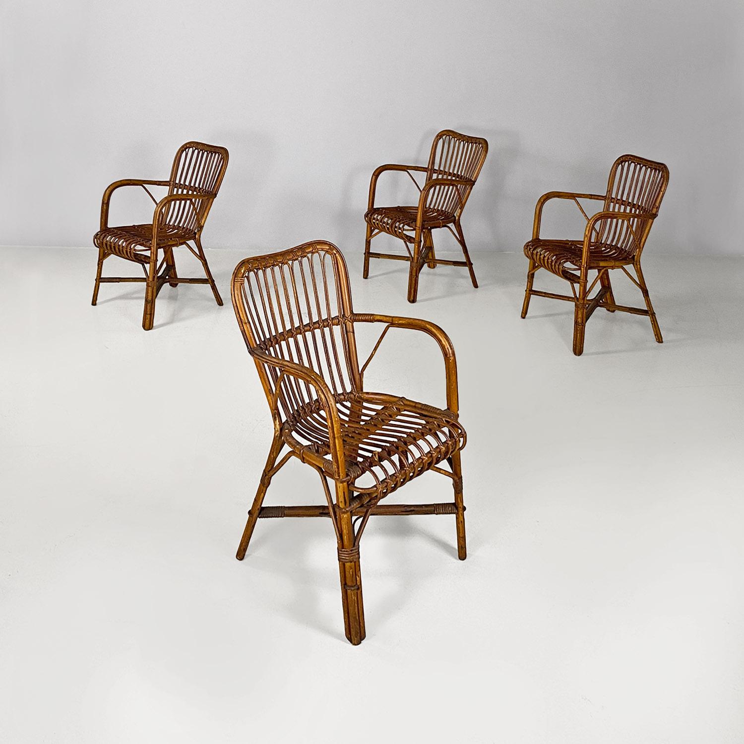 Italian mid century modern four rattan armchairs with armrests, 1960s.
Set of four armchairs with curved armrests, in different shades in finely woven rattan. The legs are joined in the middle by a crossed structure. Suitable for outdoor use, such