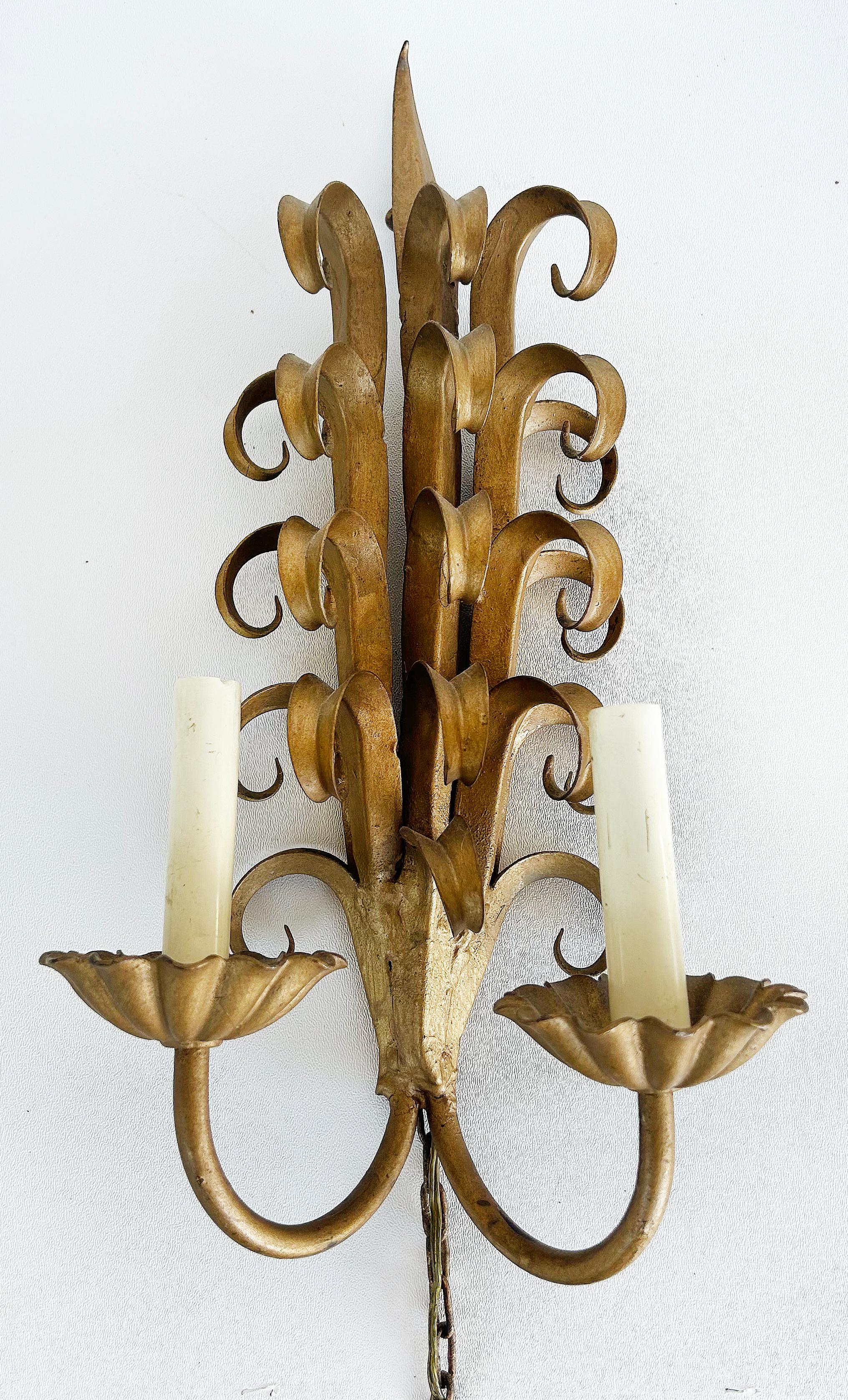 Italian Mid-century Modern Gilt Wrought Iron Sconces from a New York City Estate

Offered for sale is a pair of Italian mid-century modern gilt wrought iron sconces from a New York City estate.  We have the matching mirror available in another