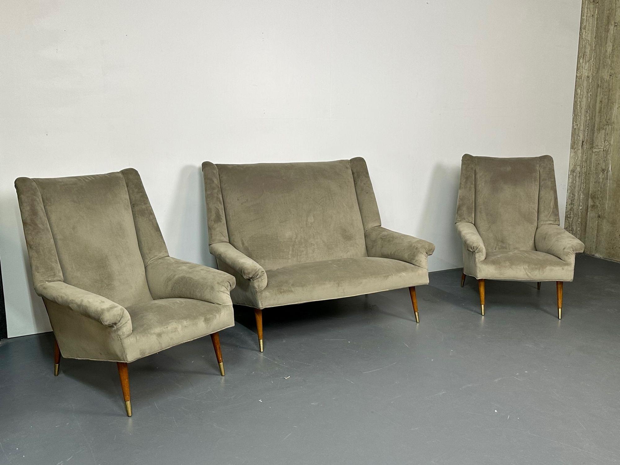 Italian Mid-Century Modern Gio Ponti Style sofa / Lounge chairs, Velvet, Walnut, Unsigned

Chic Italian sofa set of the mid-century period. This set includes a two-seater sofa/settee as well as two matching lounge/arm chairs. Each piece having