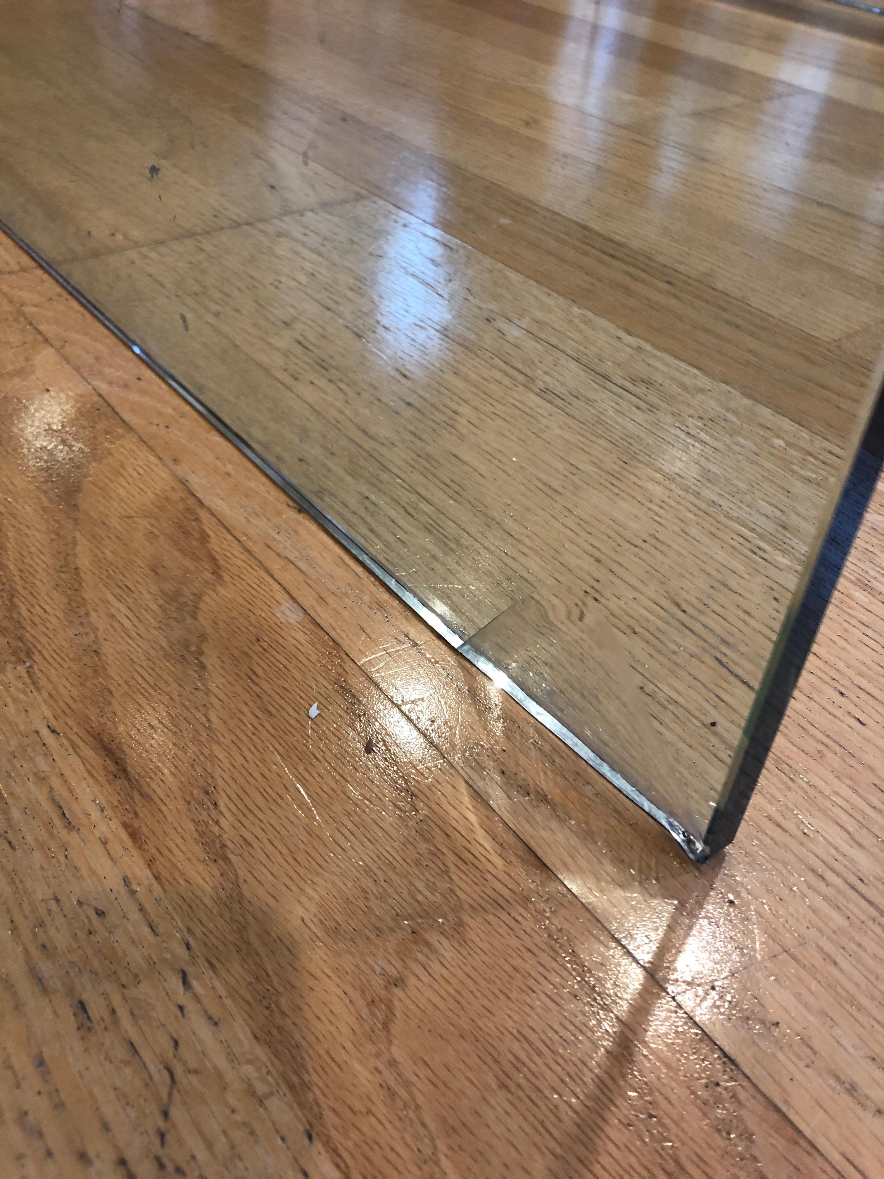 Sleek heavy glass waterfall style Mid-Century Modern coffee table made in Italy.