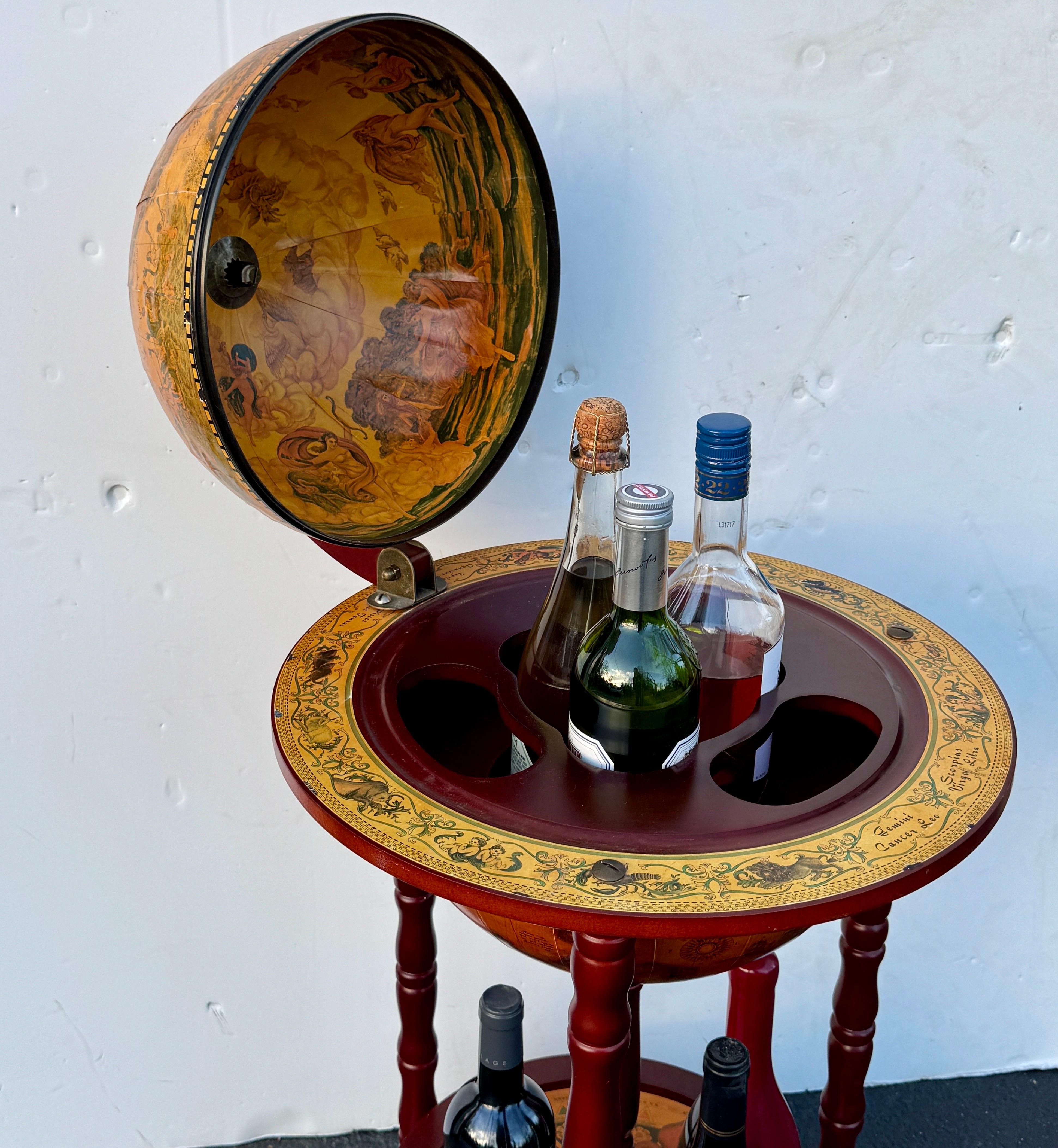 This impressive Italian mid-size dry bar from the 1960’s is perfect for adding a touch of classic European flair to your home. The globe is quite detailed with a paper decorated picturesque world map as well as zodiac signs around the frame. The
