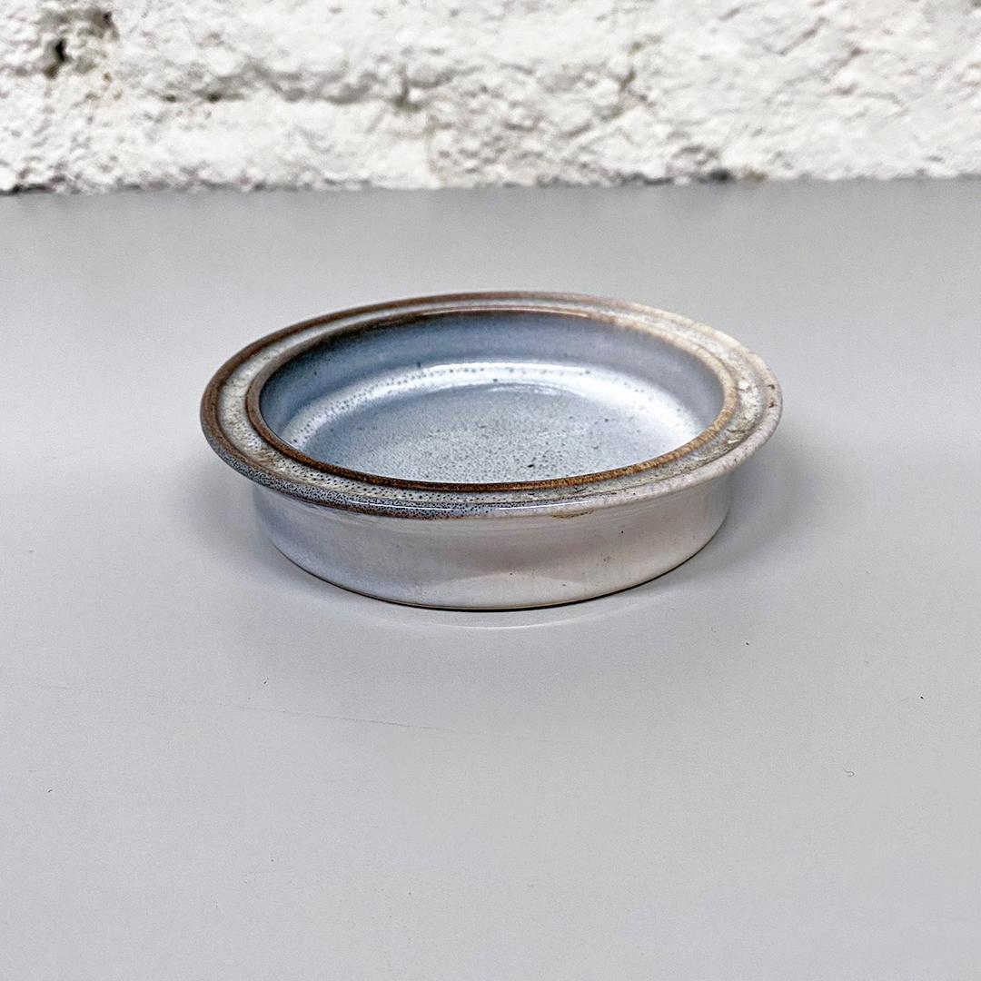 Italian Mid-Century Modern gray glazed ceramic ashtray by Bucci, 1960s
Gray glazed ceramic ashtray.
Signed Bucci, 1960s

Very good condition

Measurements 14× 3 H cm.