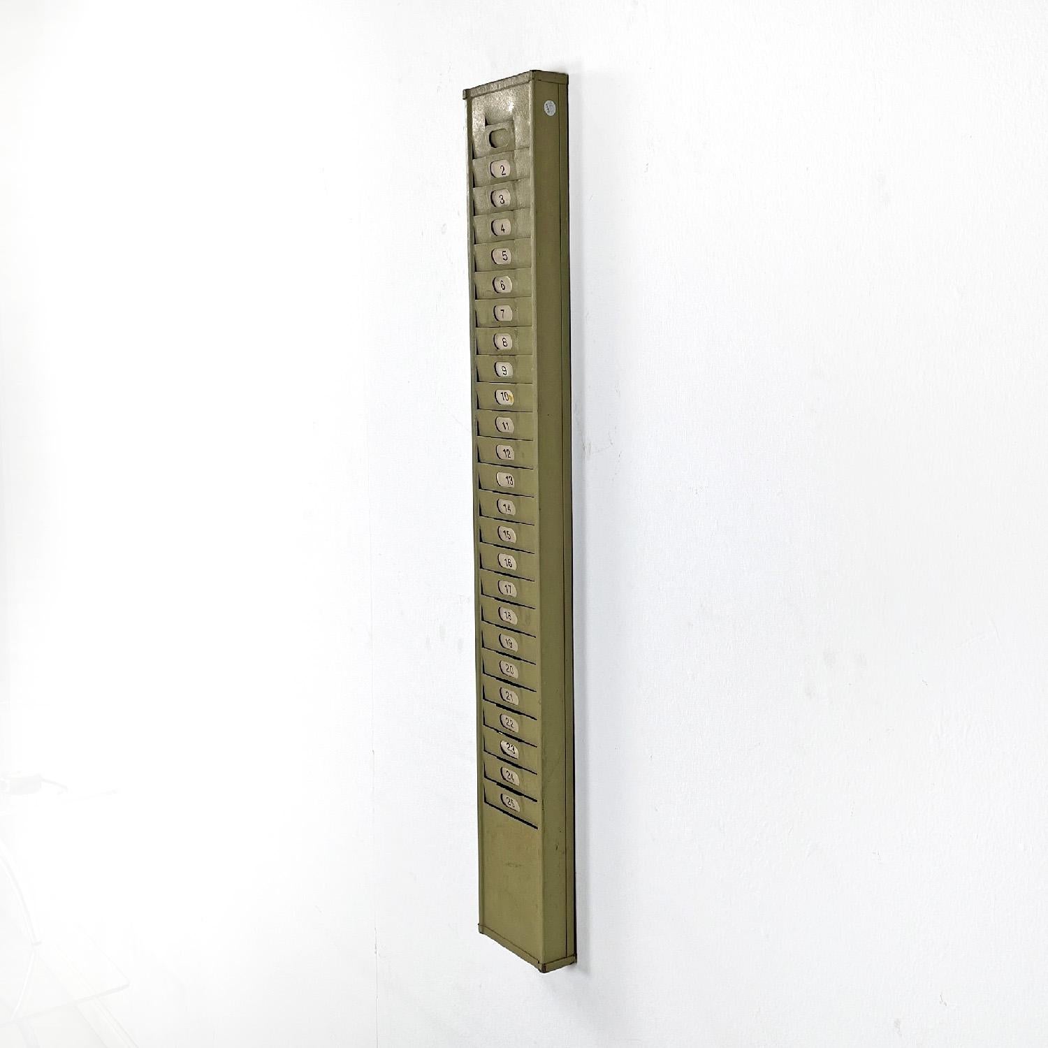 Italian mid-century modern gray metal wall filing cabinet card holder, 1960s
Gray painted rectangular industrial wall card holder or filing cabinet. It has twenty-five numbered places where you can insert cards or tags.
1960s.
Vintage condition, it