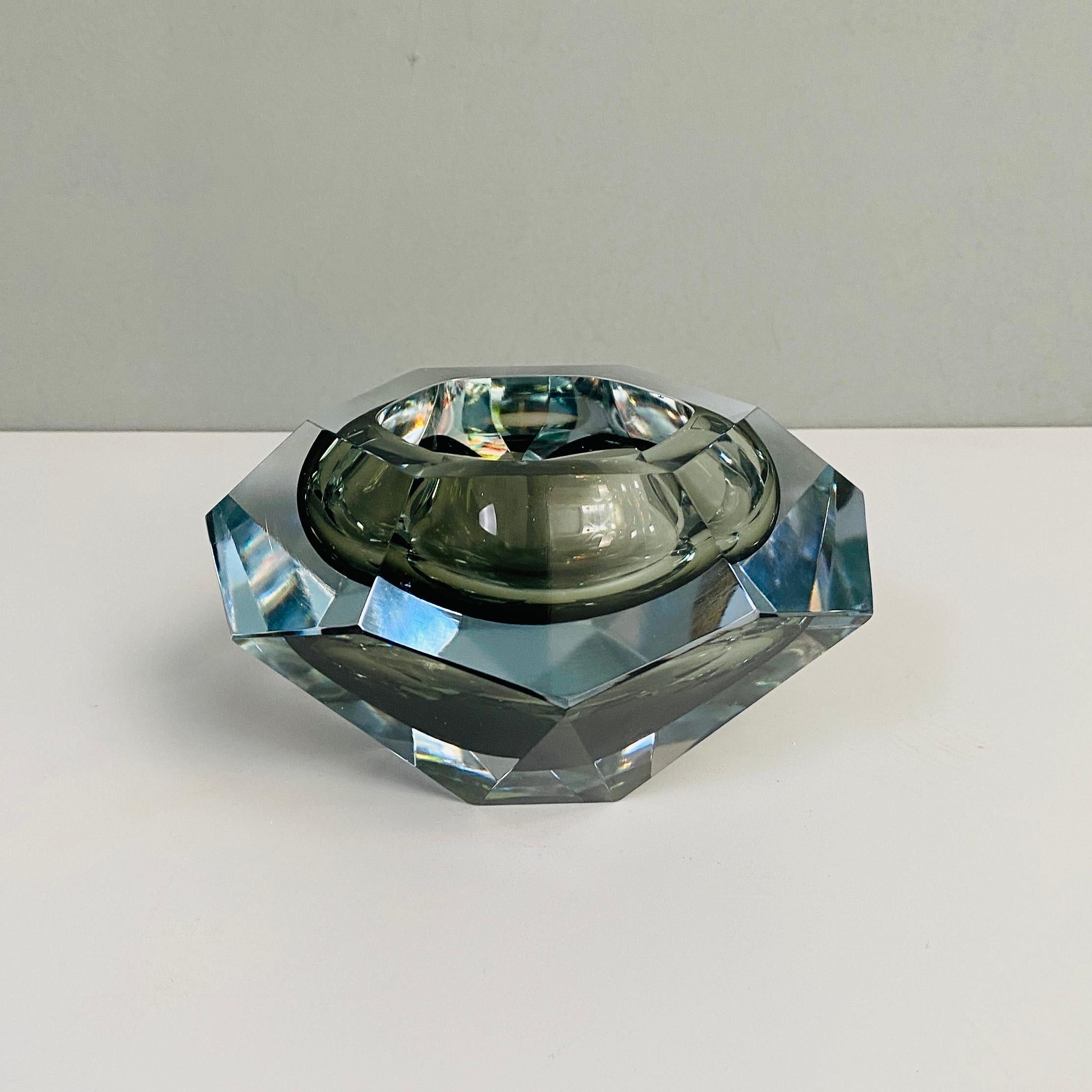 Gray Murano glass object holder, 1970s
Faceted object holder in gray Murano glass.
1970s 

Good condition, with a small chip.

This Fantastic series of Murano glass vase with various colored shades, is the 