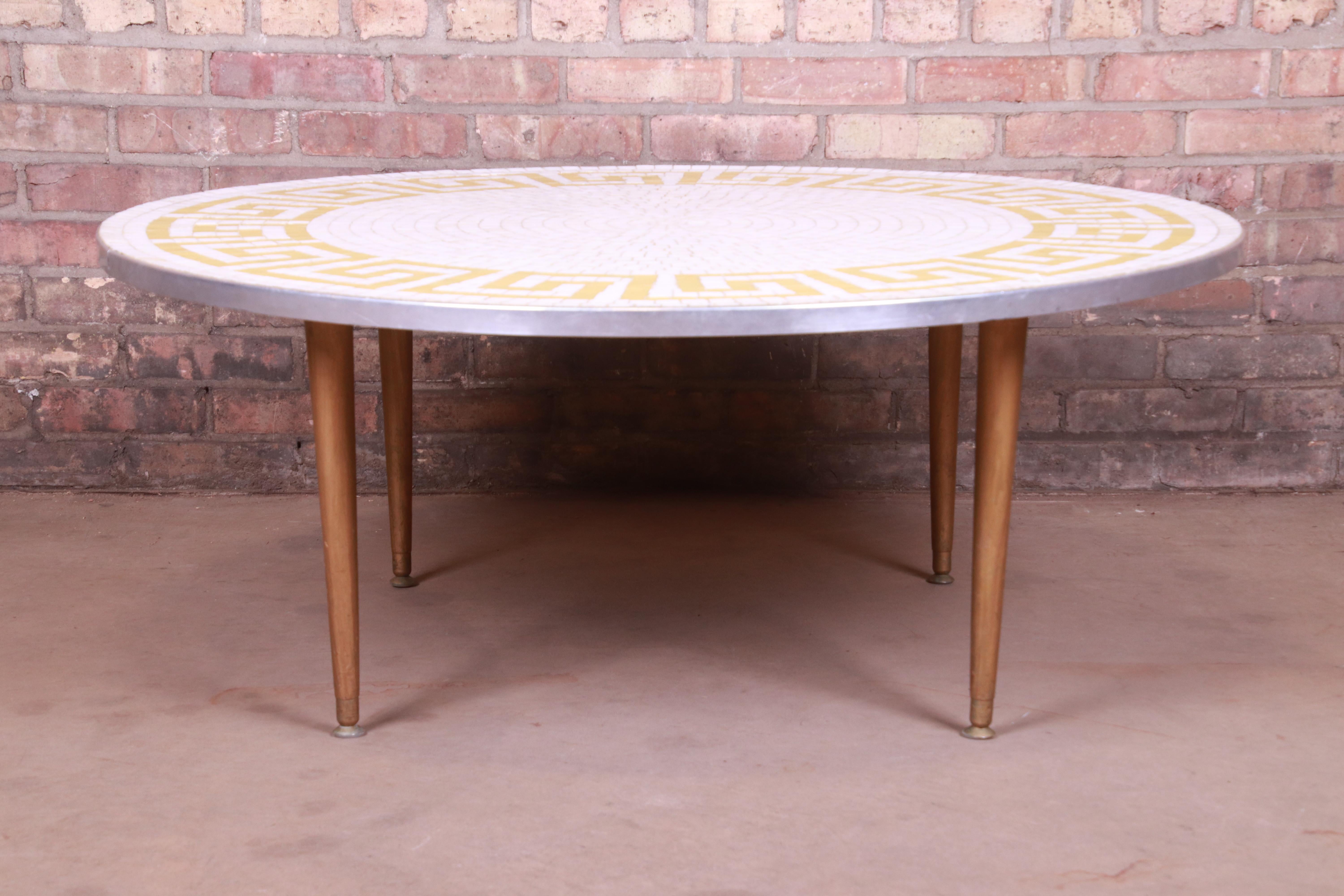 An exceptional Mid-Century Modern Greek Key mosaic tile coffee or cocktail table with removable Lazy Susan

Italy, circa 1950s

Measures: 42.25