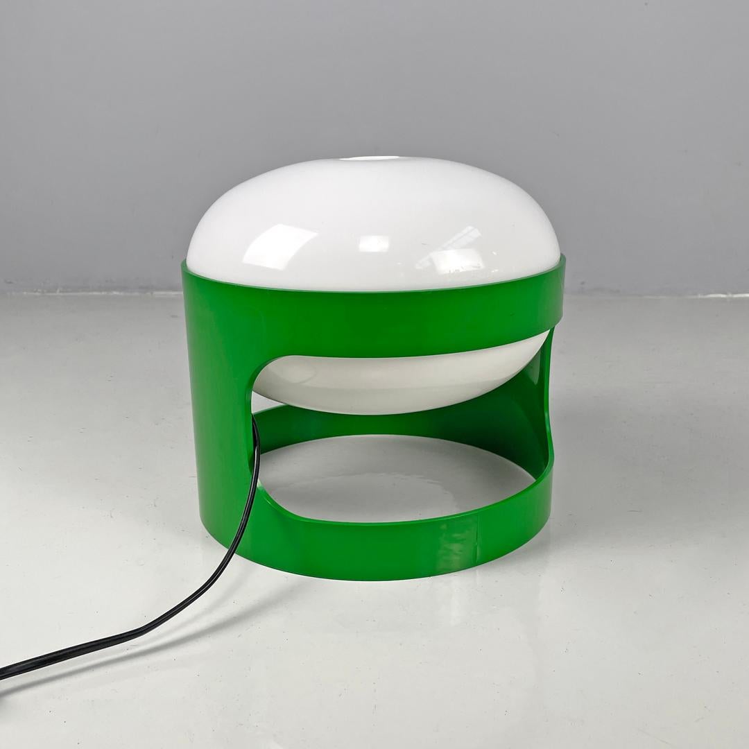 Italian mid-century modern green plastic table lamp KD27 Colombo Kartell, 1960s
Table lamp mod. KD27 in green plastic. The cylindrical structure has a rectangular hole with rounded corners in the center, in the upper part the elliptical lampshade in