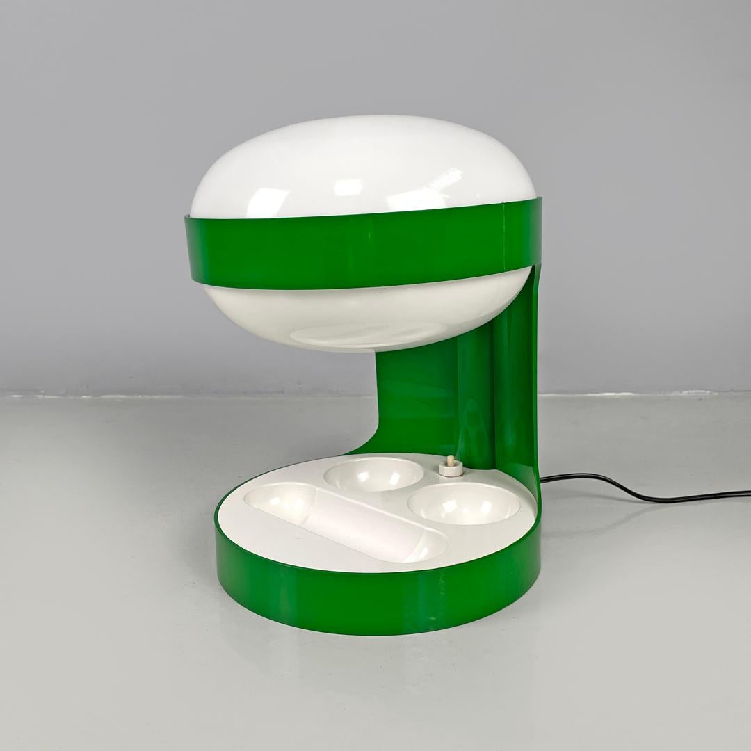 Italian mid-century modern green plastic table lamp KD29 Colombo Kartell, 1960s
Table lamp mod. KD29 round in green plastic. On the upper part there is the elliptical lampshade in opaline white plastic with a hole in the upper part. The 