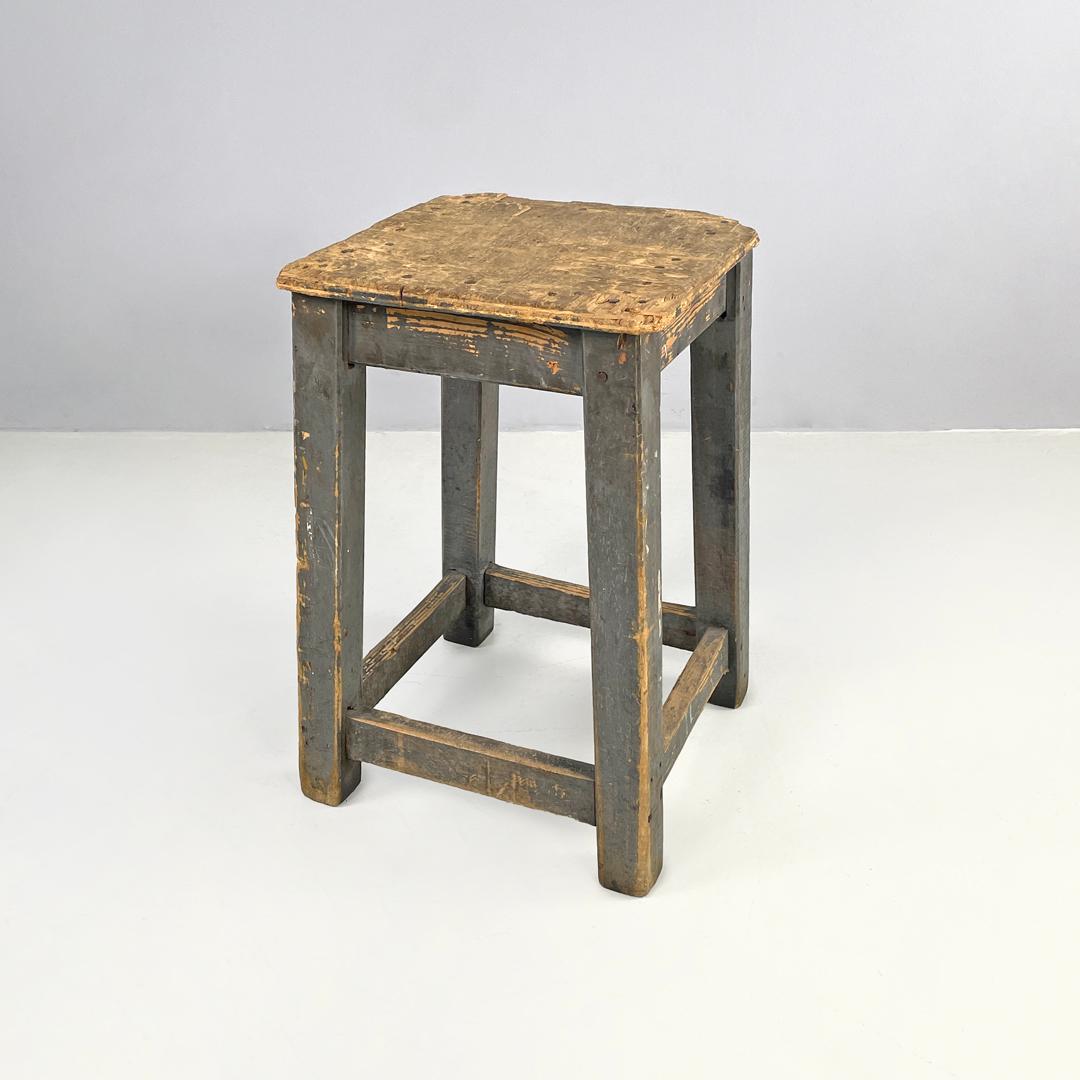 Italian mid-century modern industrial gray painted wooden stool, 1950s
Industrial wooden stool. The seat is square, the four legs have a square section with four beams at the base that act as footrests. The stool is painted grey. The elements that