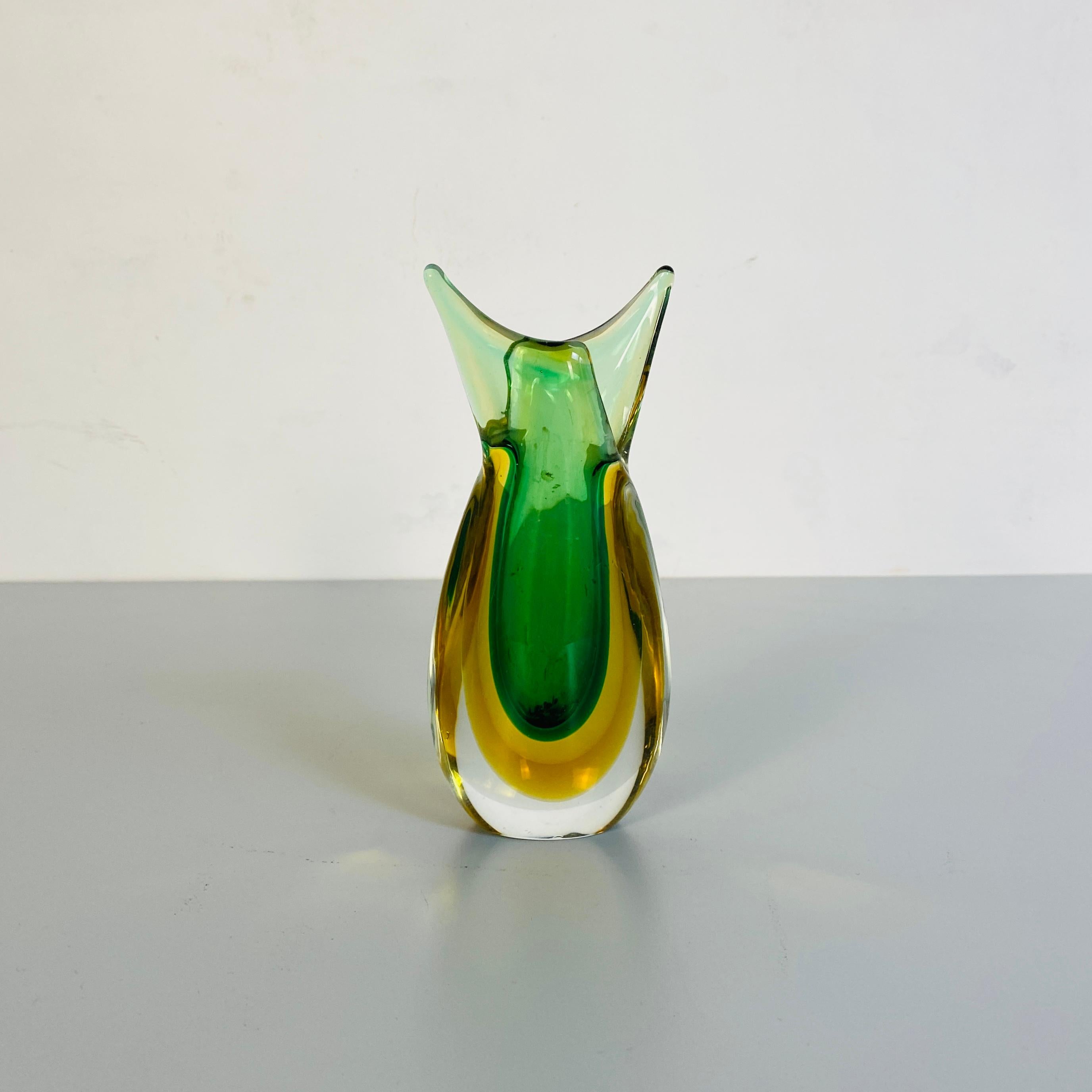 Italian Mid-Century Modern irregular Murano glass vase, green and yellow, 1970s
Irregular vase in Murano glass from the Sommersi series, in transparent, green and yellow.

This Fantastic series of Murano glass vase and ashtray with various colored