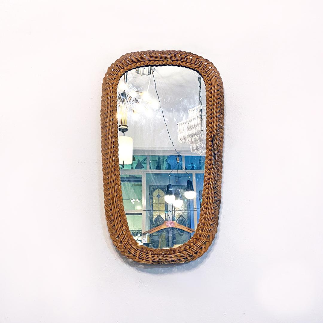 Italian Mid-Century Modern irregulary wicker mirror, 1960s
Irregularly shaped mirror with woven wicker frame.
1960s
Good condition, some flaws in the lower and right part, as shown in the photos.
Measurements in cm 44 x 78 H.